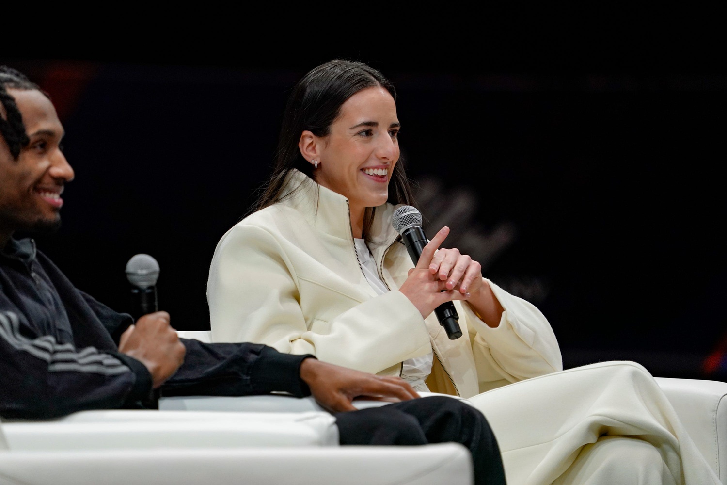 Darryn Peterson and Caitlin Clark gather with Jalen Rose on a court during the Final Four Fan Fest for a panel discussion at the Indiana Convention Center on Friday, April 3, 2026, in Indianapolis. - Source: Imagn