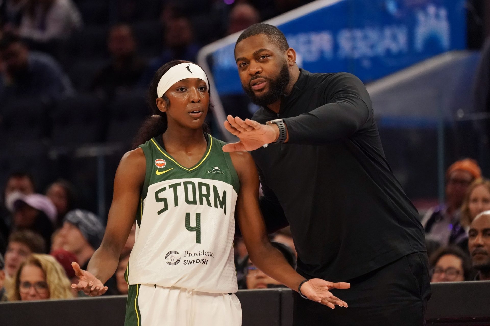 Seattle Storm guard Flau'jae Johnson (4) and assistant coach Michael Joiner talk during a timeout against the Golden State Valkyries in the third quarter at Chase Center. - Source: Imagn