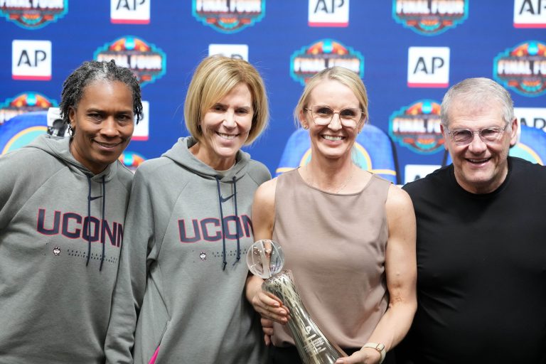 Vanderbilt Commodores coach Shea Ralph (second from right) poses with UConn Huskies assistant coach Jamelle Elliott (left), associate head coach Chris Dailey (second from left) and head coach Geno Auriemma (right) after receiving the Associated Press Coach of the Year award at press conference at the 2026 NCAA Final Four women's basketball championship Mortgage Matchup Center. Source: Kirby Lee-Imagn Images