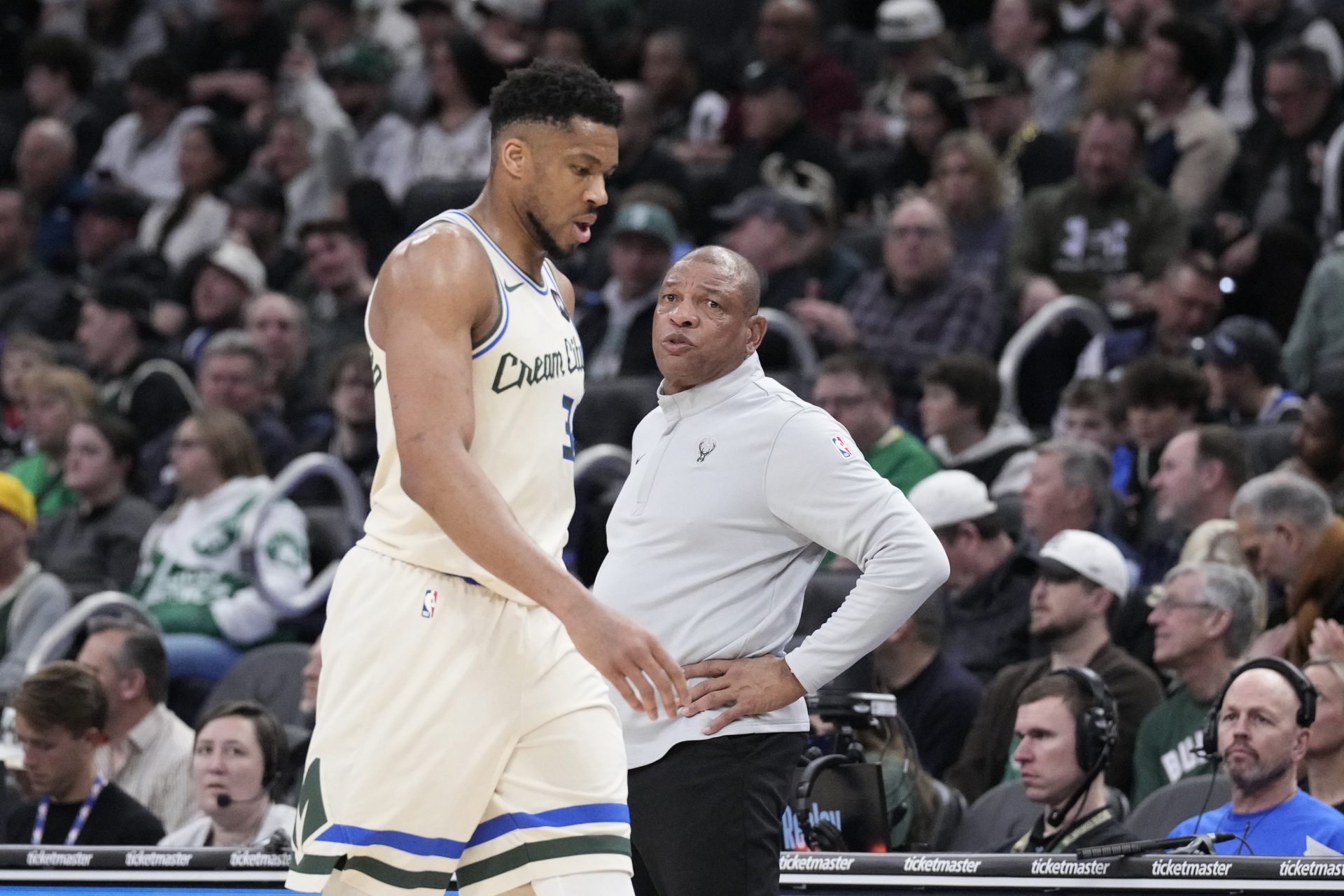 Milwaukee Bucks forward Giannis Antetokounmpo (34) comes out of the game near the end of the second quarter and walks past Milwaukee Bucks head coach Doc Rivers as they compete against the Boston Celtics at Fiserv Forum. - Source: Imagn