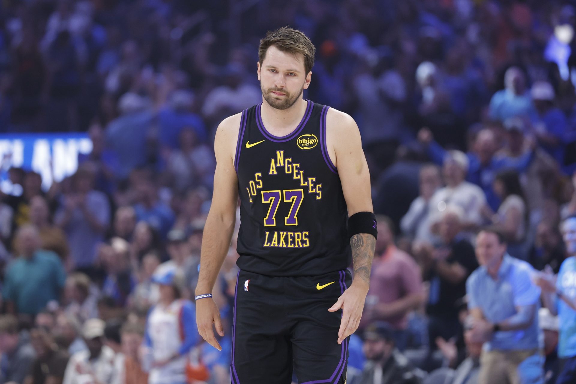 Los Angeles Lakers guard Luka Doncic (77) walks across the court after a play against the Oklahoma City Thunder during the first quarter at Paycom Center.