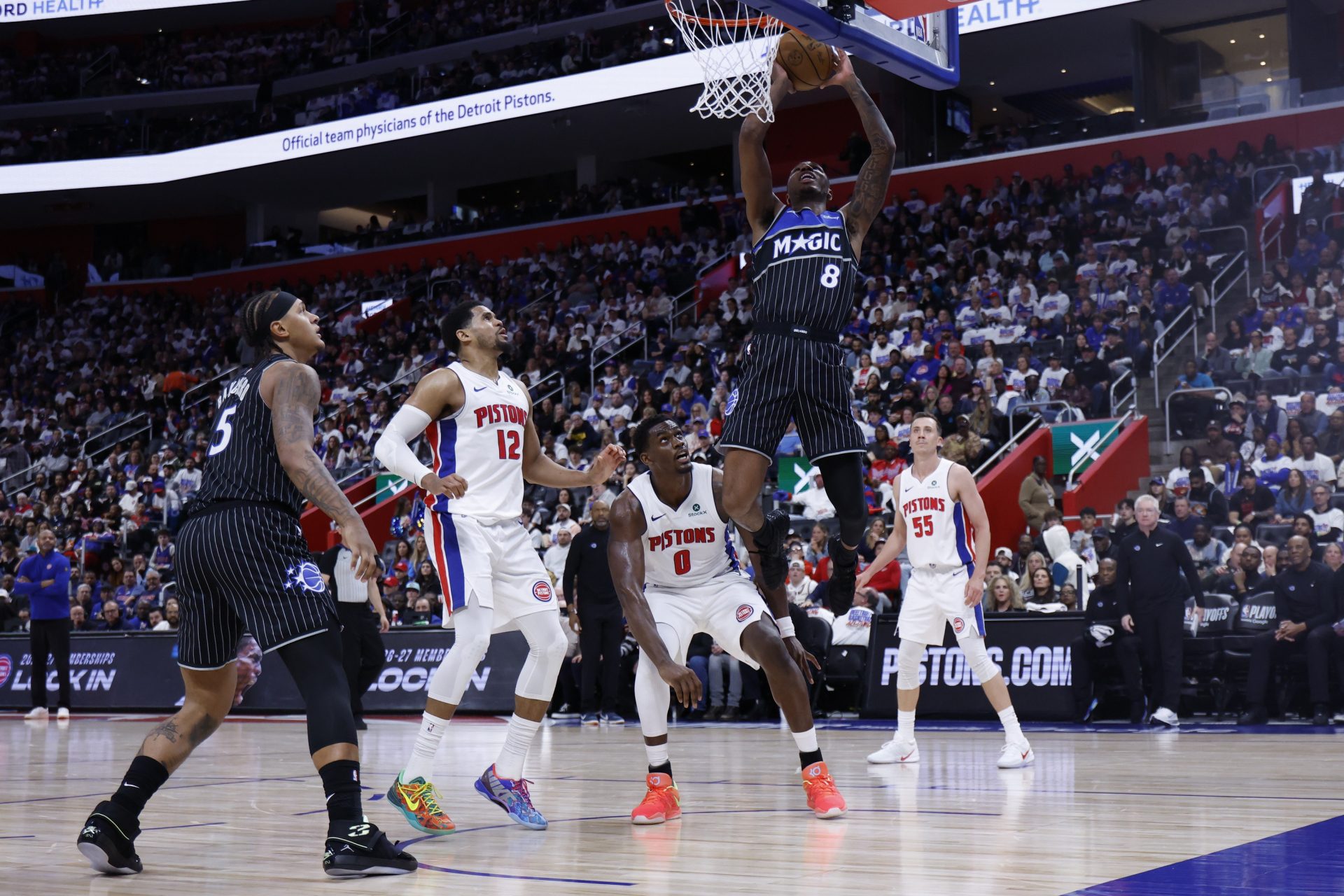 Orlando Magic forward Jamal Cain (8) dunks on Detroit Pistons center Jalen Duren (0) in the first half during the 2026 NBA Playoffs at Little Caesars Arena. - Source: Imagn