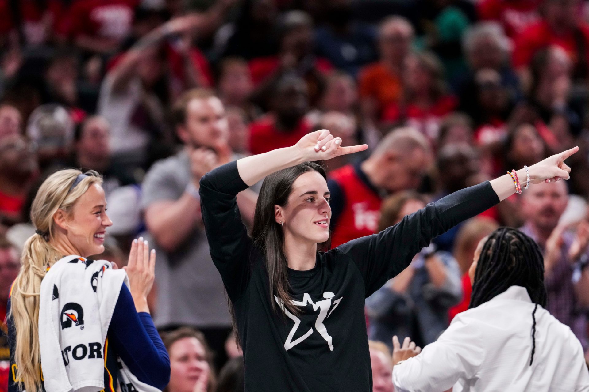 Indiana Fever guard Sophie Cunningham (8) and Indiana Fever guard Caitlin Clark (22) celebrate from the bench Thursday, July 3, 2025, during a game between the Indiana Fever and the Las Vegas Aces at Gainbridge Fieldhouse in Indianapolis - Source: Imagn Images