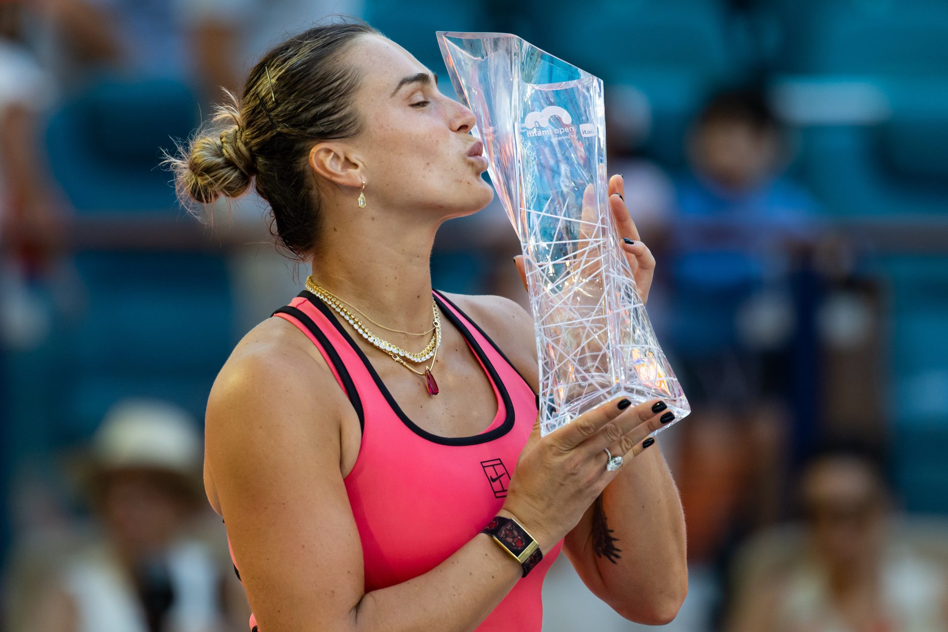 Aryna Sabalenka of Belarus poses with the Butch Buchholz Championship trophy after defeating Coco Gauff of the United States in the final of the womenÕs singles at the Hard Rock Stadium.
