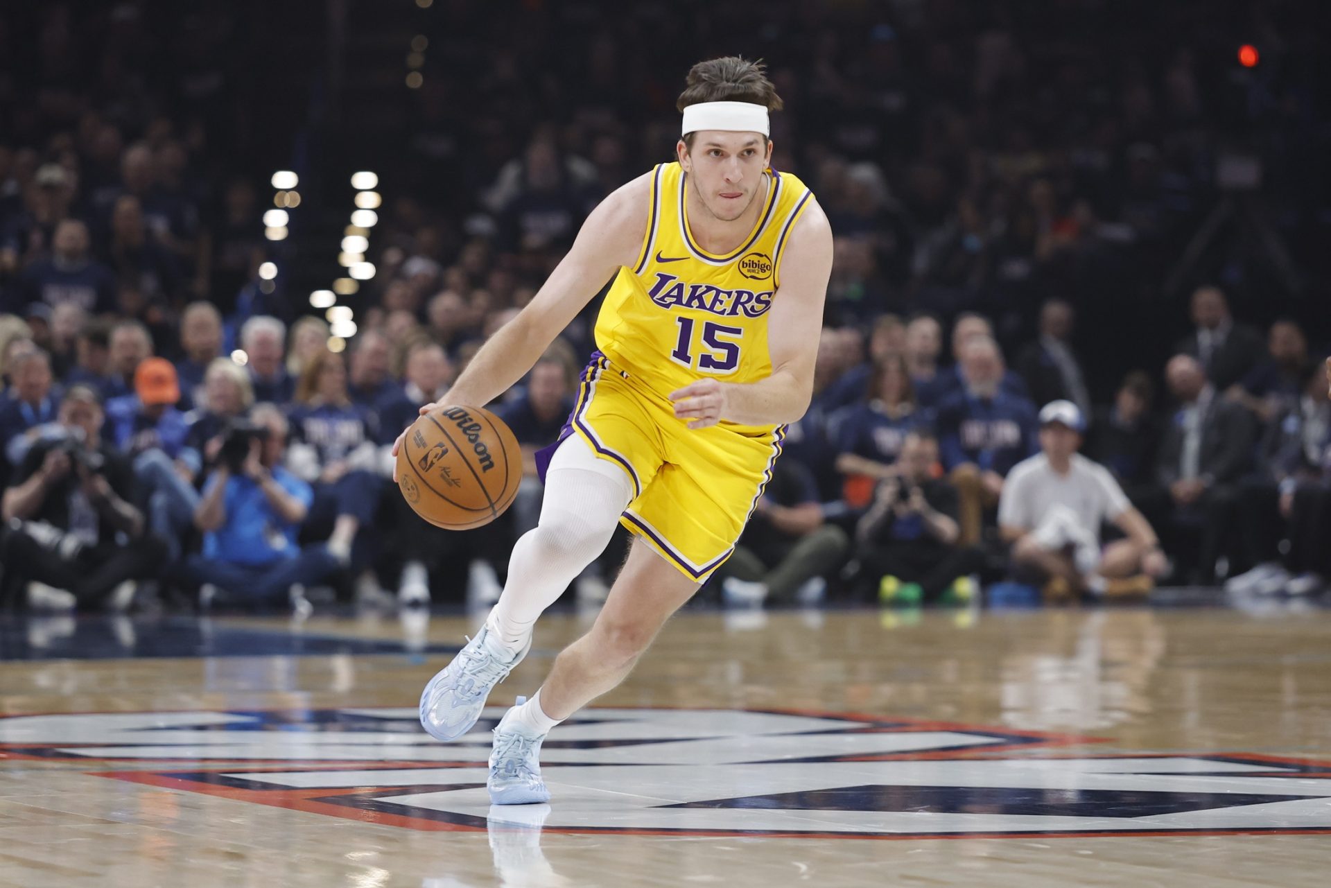Los Angeles Lakers guard Austin Reaves (15) dribbles down the court against the Oklahoma City Thunder in the first half during game two of the second round of the 2026 NBA Playoffs at Paycom Center - Source: Imagn Images