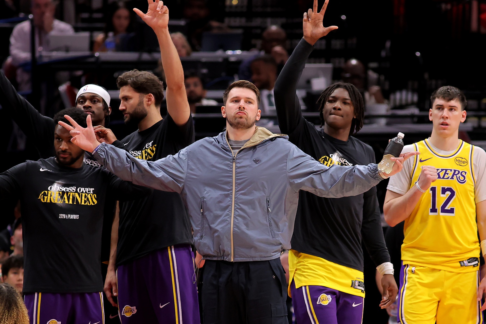 Los Angeles Lakers guard Luka Doncic (77, middle) reacts after a made basket against the Houston Rockets during the fourth quarter of game six of the first round of the 2026 NBA Playoffs at Toyota Center.