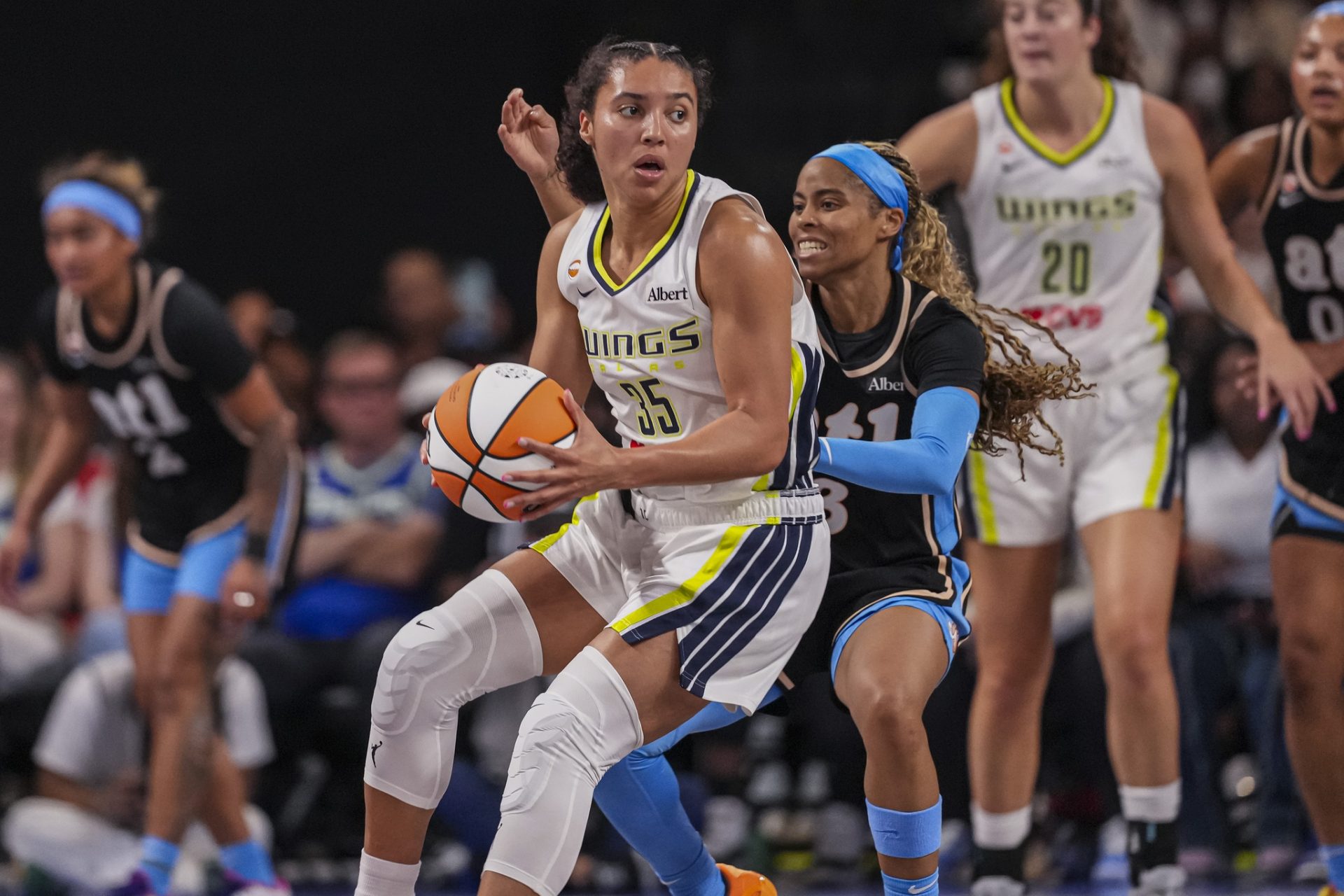 Dallas Wings guard Azzi Fudd (35) controls the ball in front of Atlanta Dream guard Jordin Canada (3) during the first half at Gateway Center Arena in College Park.