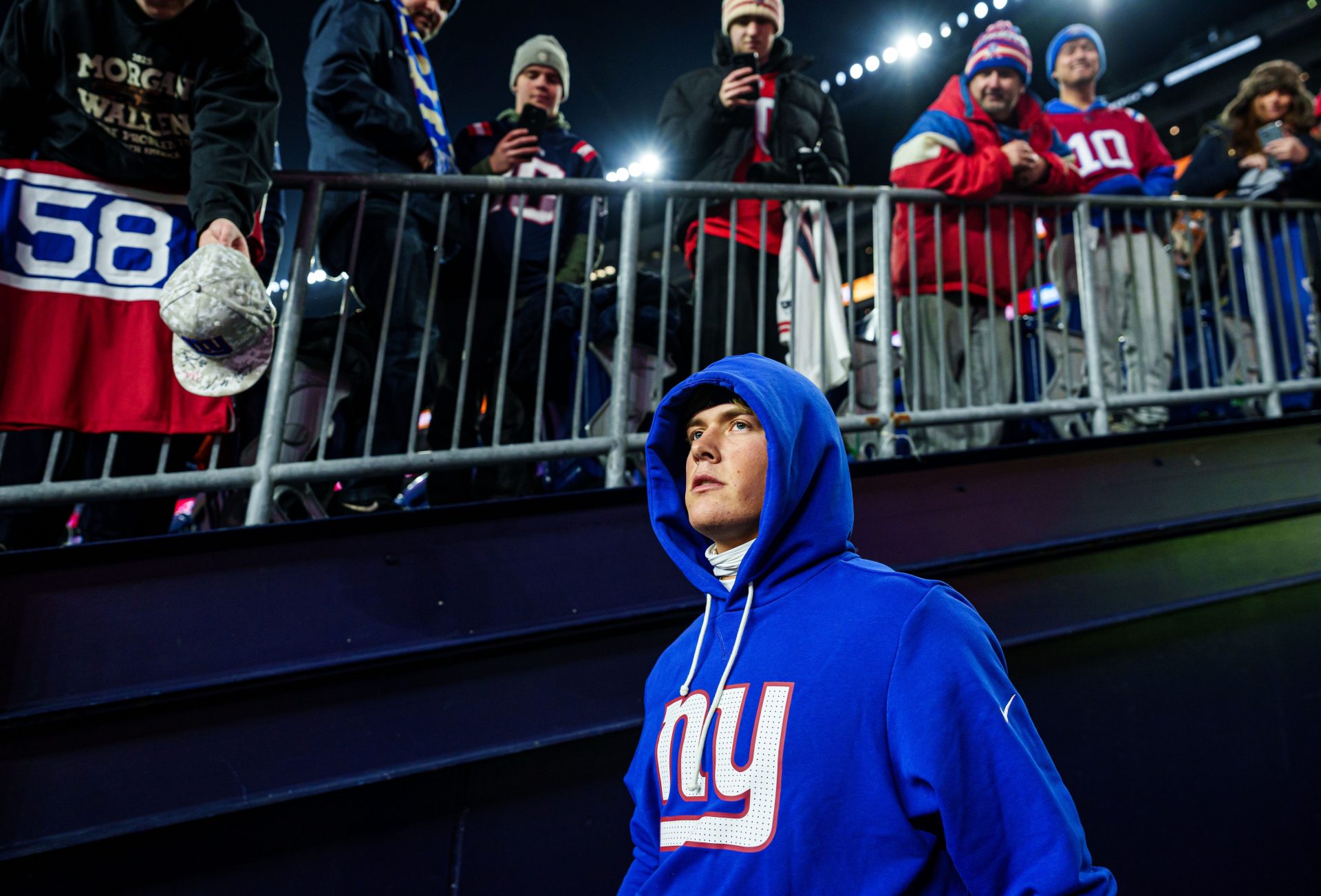 New York Giants quarterback Jaxson Dart (6) walks onto the field prior to the game against the New England Patriots at Gillette Stadium.