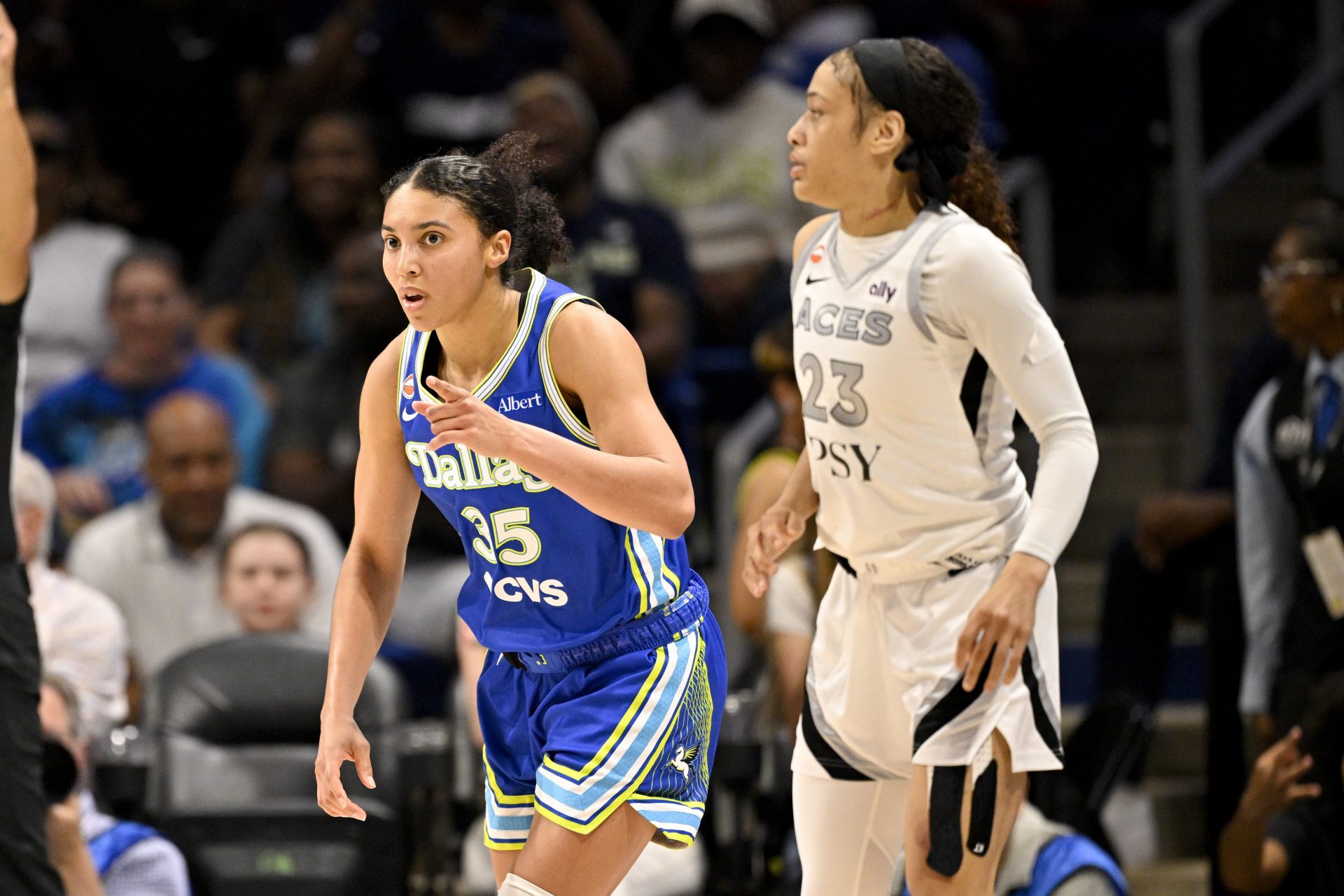 Dallas Wings guard Azzi Fudd (35) celebrates as Las Vegas Aces guard Chennedy Carter (23) looks on during the second half at College Park Center - Source: Imagn Images