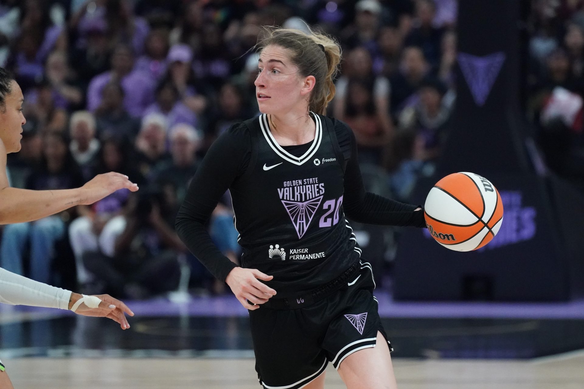Golden State Valkyries guard Kate Martin (20) looks to pass while guarded by Minnesota Lynx guard Kayla McBride (21) in the second quarter at Chase Center - Source: Imagn Images
