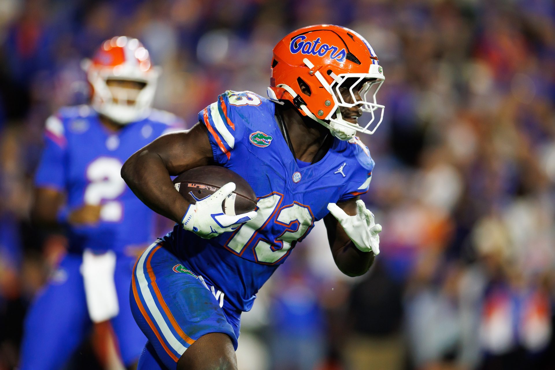 Florida Gators running back Jadan Baugh (13) runs against the Florida State Seminoles during the second half at Ben Hill Griffin Stadium.