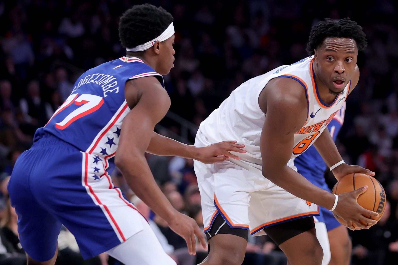 New York Knicks forward OG Anunoby (8) controls the ball against Philadelphia 76ers guard VJ Edgecombe (77) during the second quarter of game one of the eastern conference semifinal round of the 2026 NBA Playoffs at Madison Square Garden.