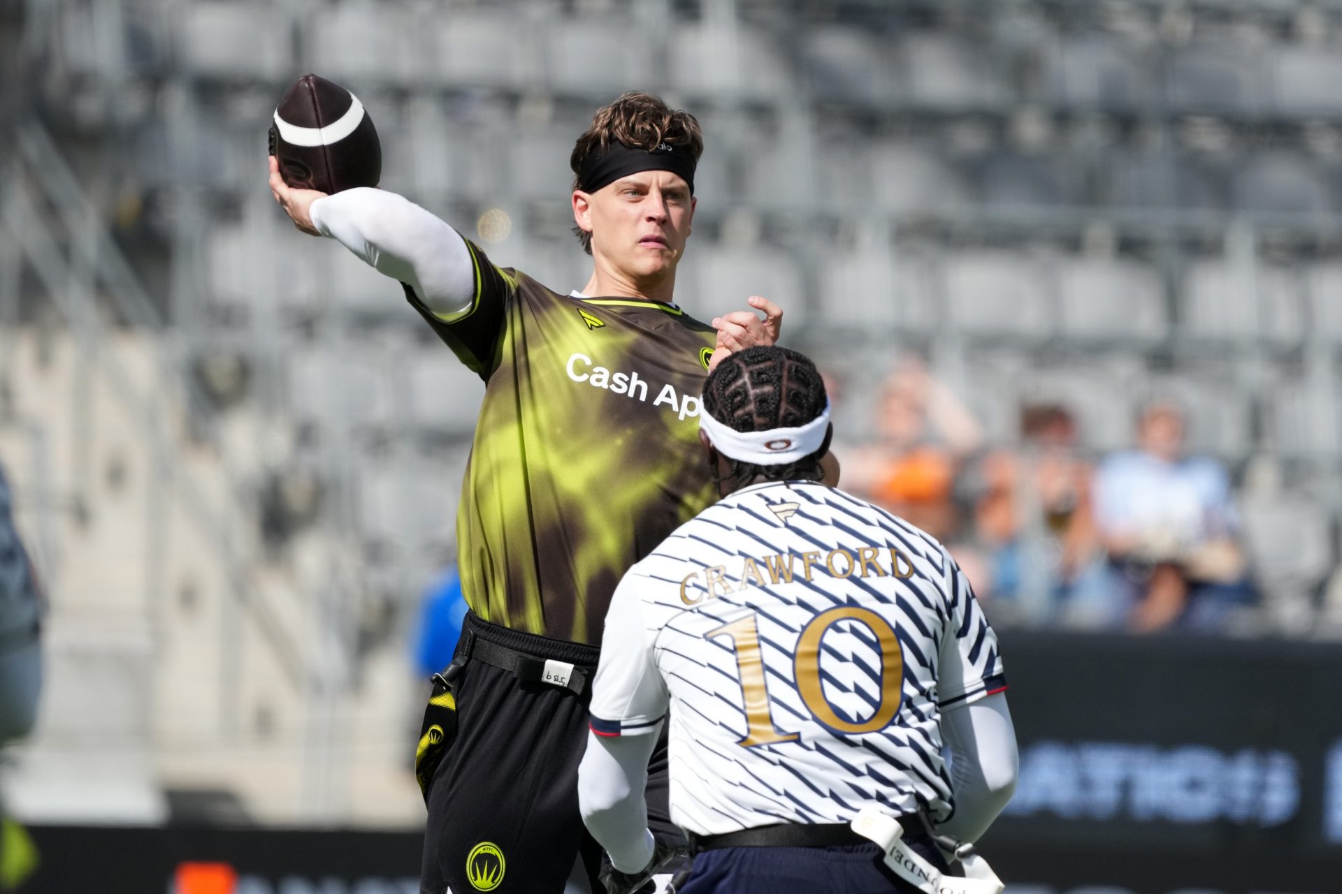 Wildcats FFC quarterback Joe Burrow throws the ball against Terence Crawford of Founders FFC during the Fanatics Flag Football Classic at BMO stadium.