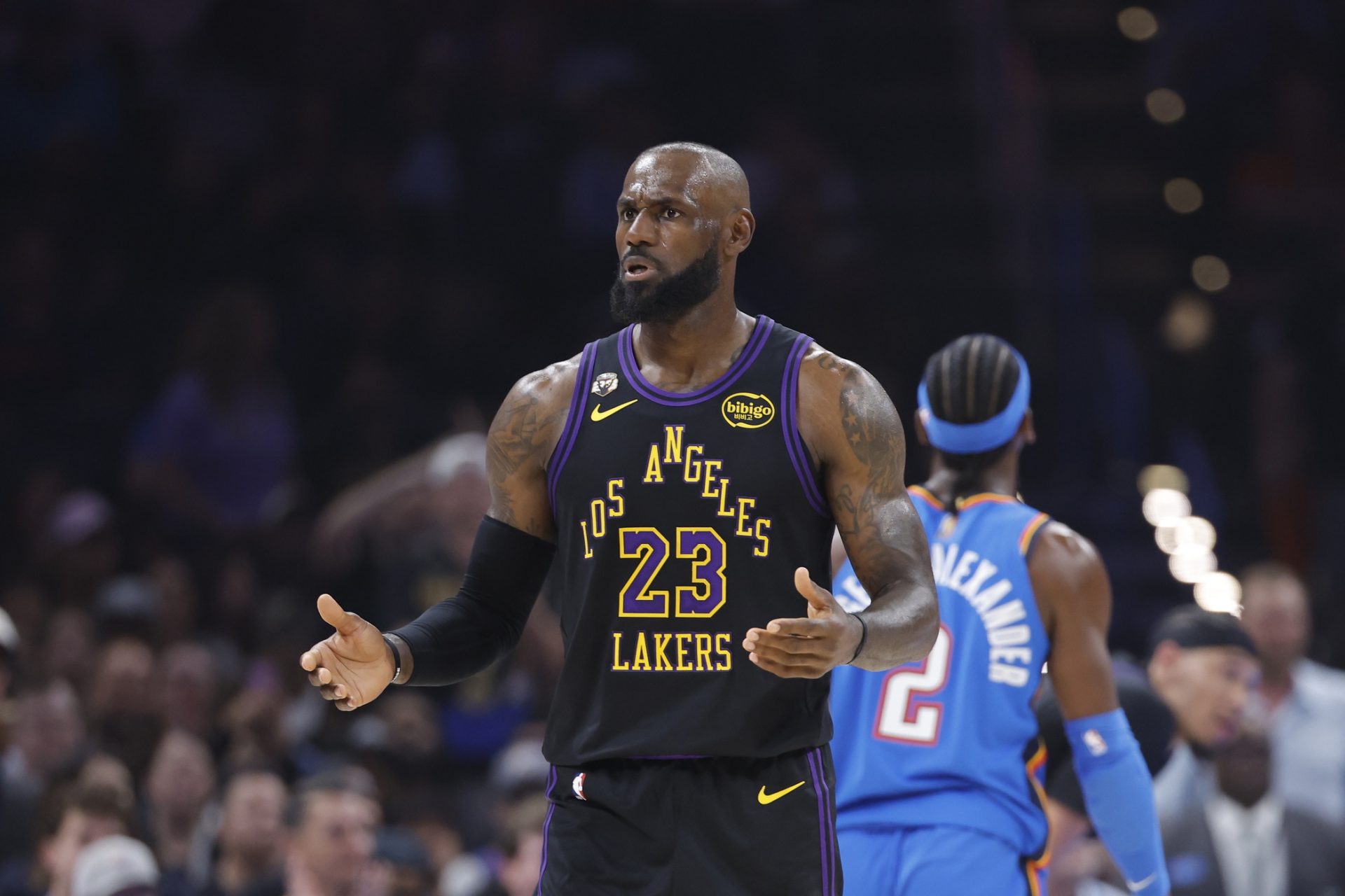 Los Angeles Lakers forward LeBron James (23) reacts after a call against hindering a play against the Oklahoma City Thunder in the first quarter at Paycom Center.