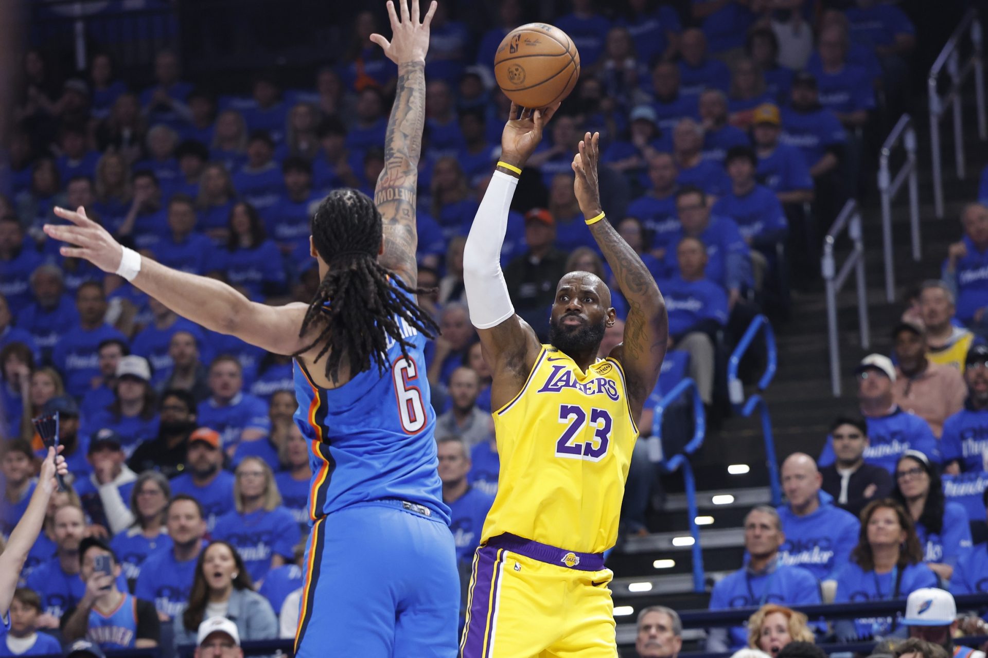 Los Angeles Lakers forward LeBron James (23) shoots as Oklahoma City Thunder forward Jaylin Williams (6) defends in the first half during game one of the second round of the 2026 NBA Playoffs at Paycom Center.