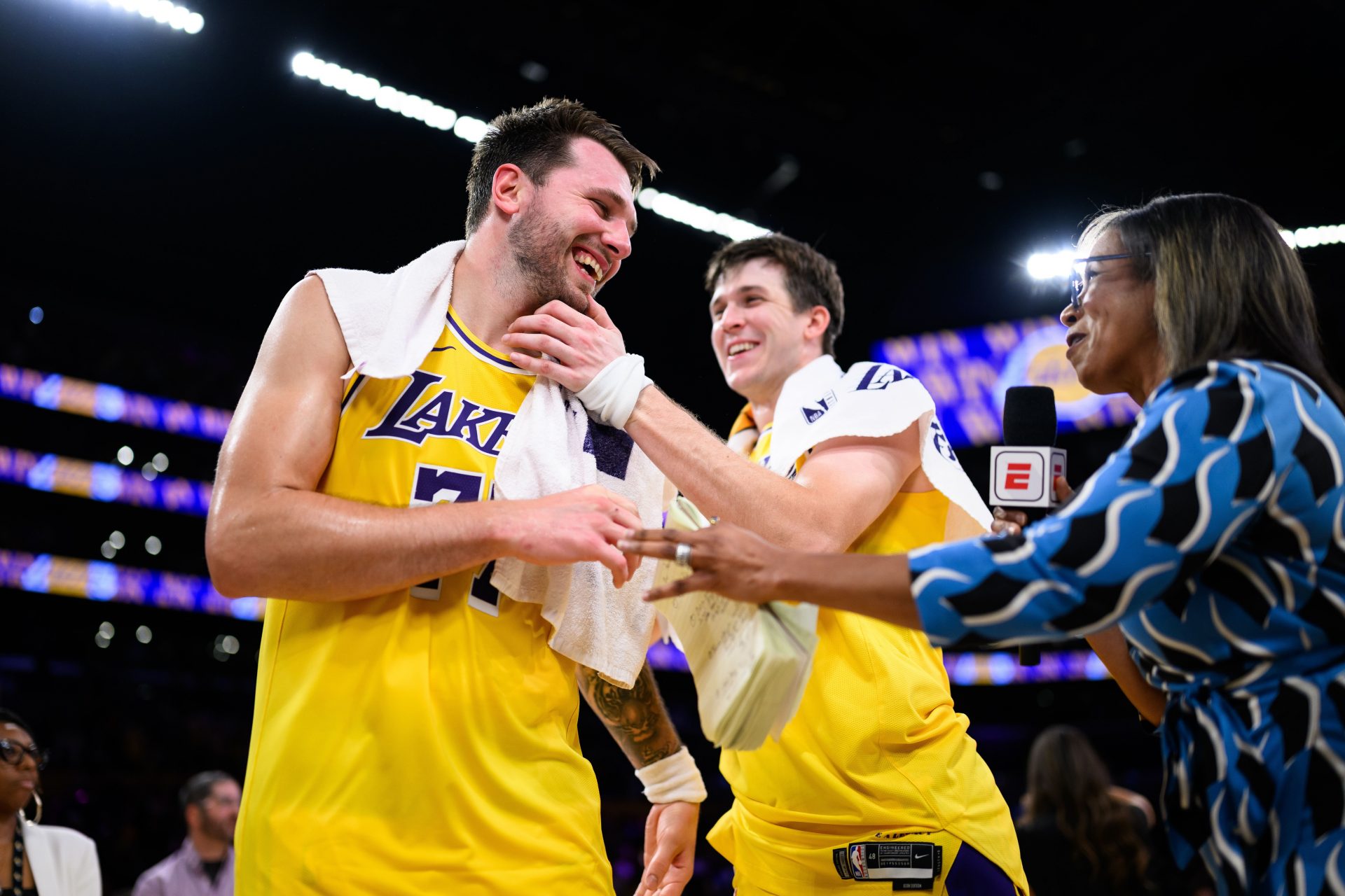 Los Angeles Lakers guard Luka Doncic (77) reacts with guard Austin Reaves (15) after scoring a game winning shot during overtime against the Denver Nuggets at Crypto.com Arena - Source: Imagn Images