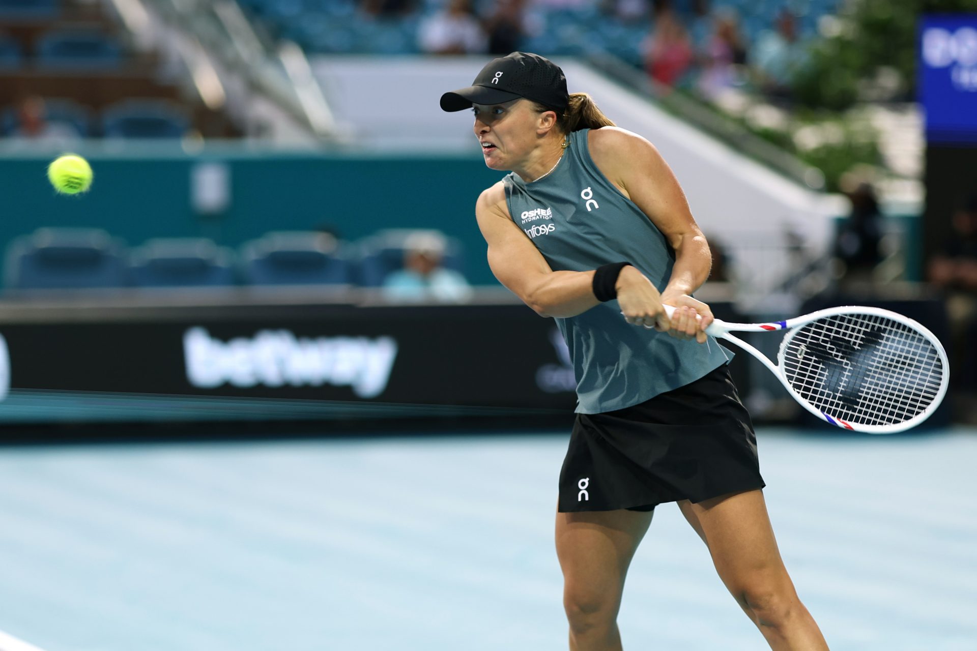 Iga Swiatek (POL) hits a backhand against Magda Linette (POL) (not pictured) on day three of the 2026 Miami Open at Hard Rock Stadium.