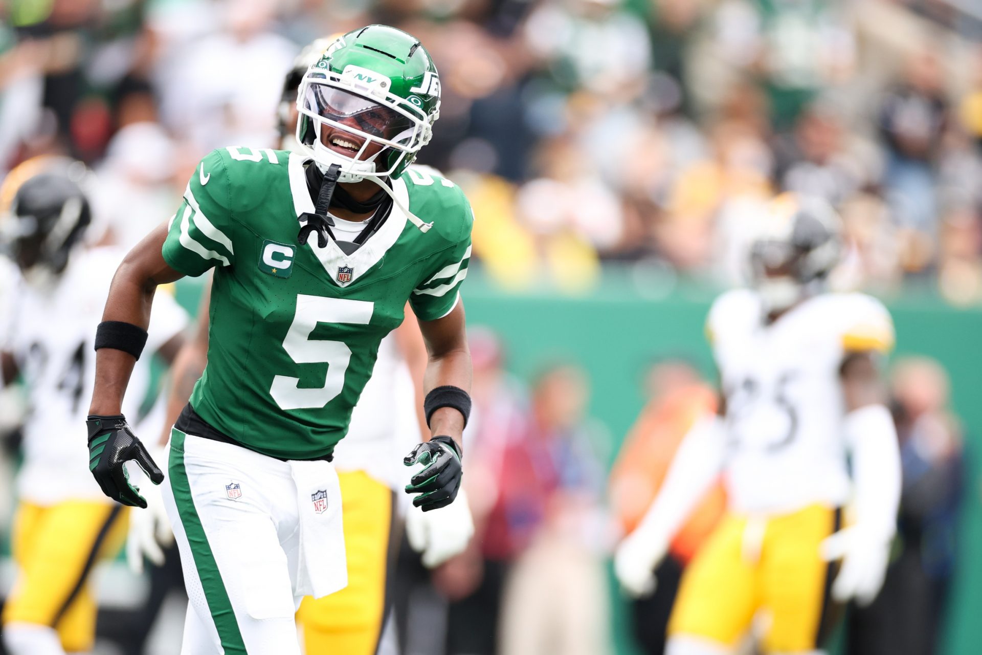 New York Jets wide receiver Garrett Wilson (5) celebrates after scoring a touchdown in the first quarter against the Pittsburgh Steelers at MetLife Stadium.