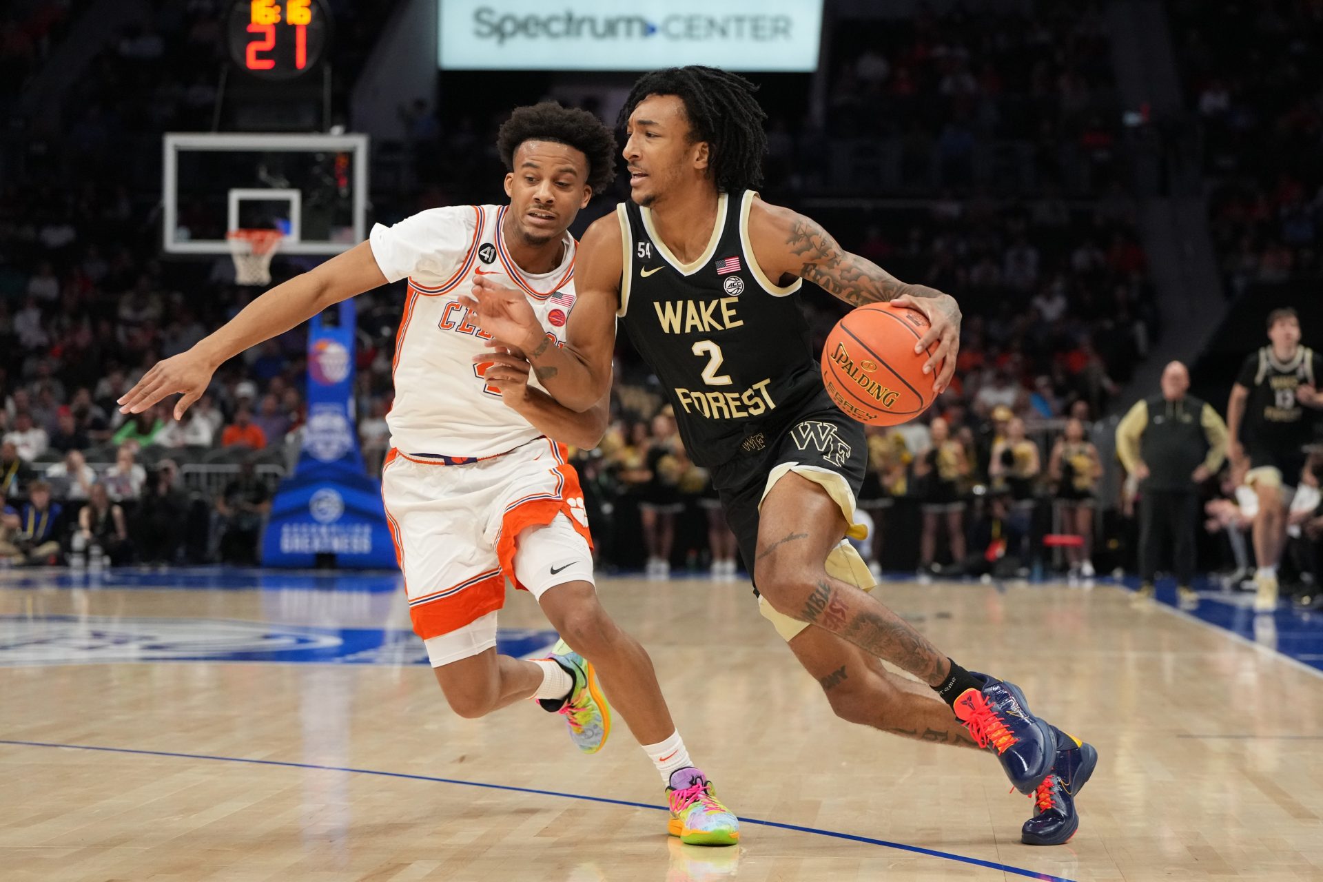 Wake Forest Demon Deacons forward Juke Harris (2) with the ball as Clemson Tigers guard Efrem Johnson (4) defends in the first half at Spectrum Center.