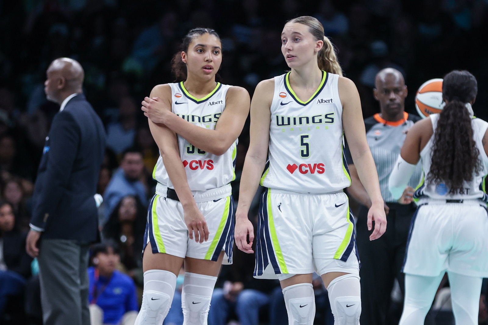 Dallas Wings guards Azzi Fudd (35) and Paige Bueckers (5) talk during a timeout in the fourth quarter against the New York Liberty at Barclays Center.