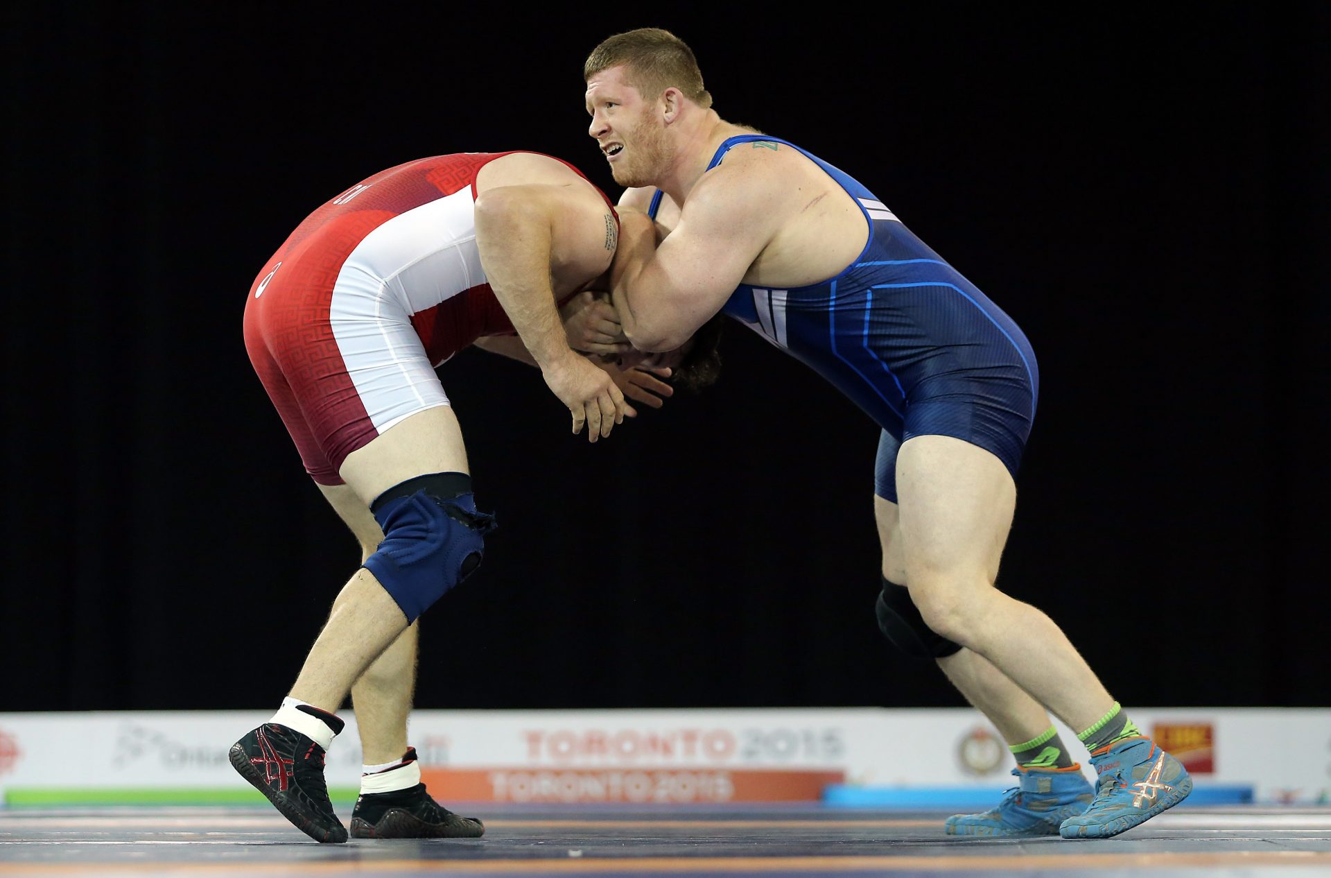 Korey Jarvis of Canada wrestles Zach Rey of the United States in the men's freestyle 125 kg gold medal final during the 2015 Pan Am Games at Mississauga Sports Centre.