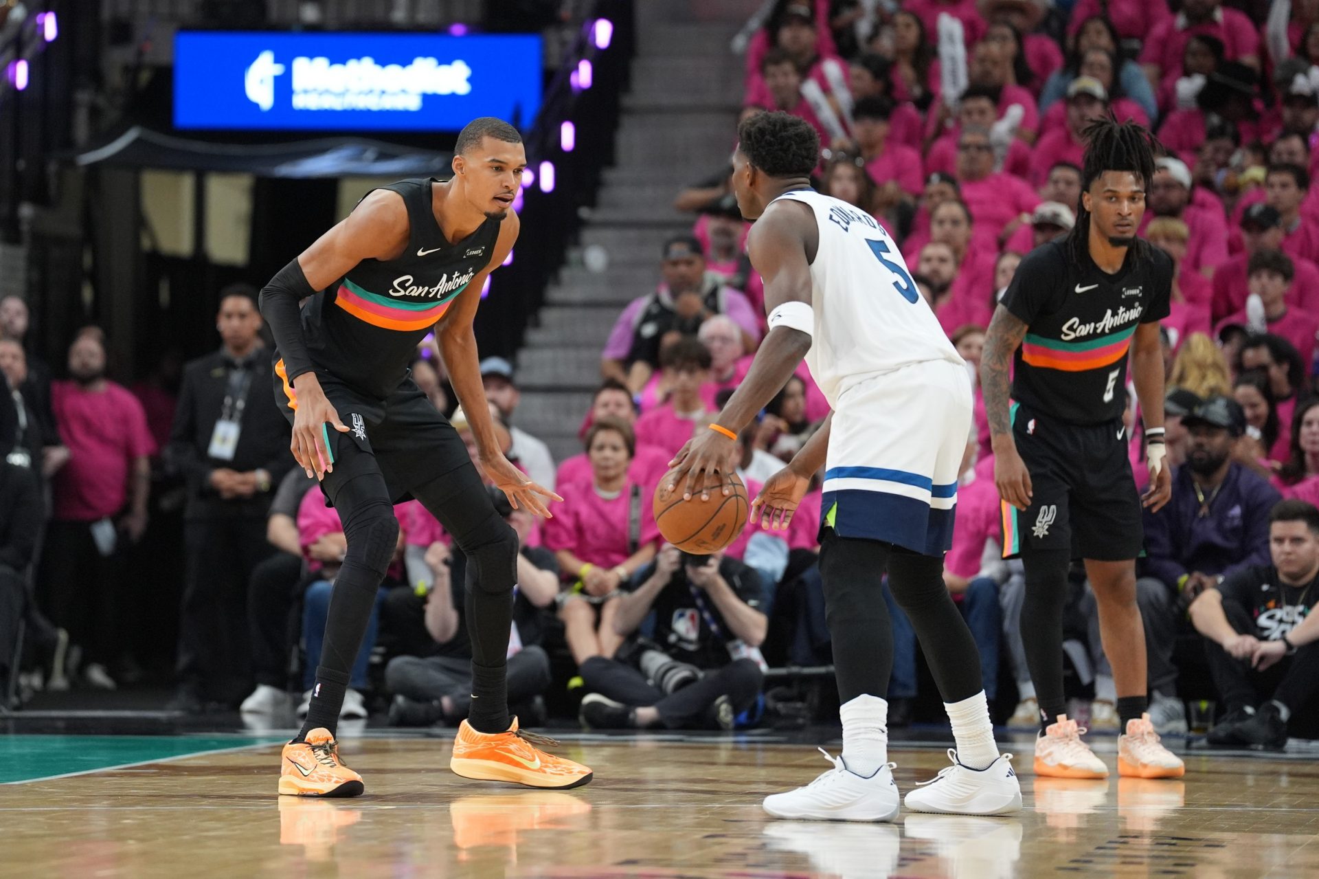 Minnesota Timberwolves guard Anthony Edwards (5) faces off against San Antonio Spurs forward Victor Wembanyama (1) in the second half during game one of the second round of the 2026 NBA Playoffs at Frost Bank Center.