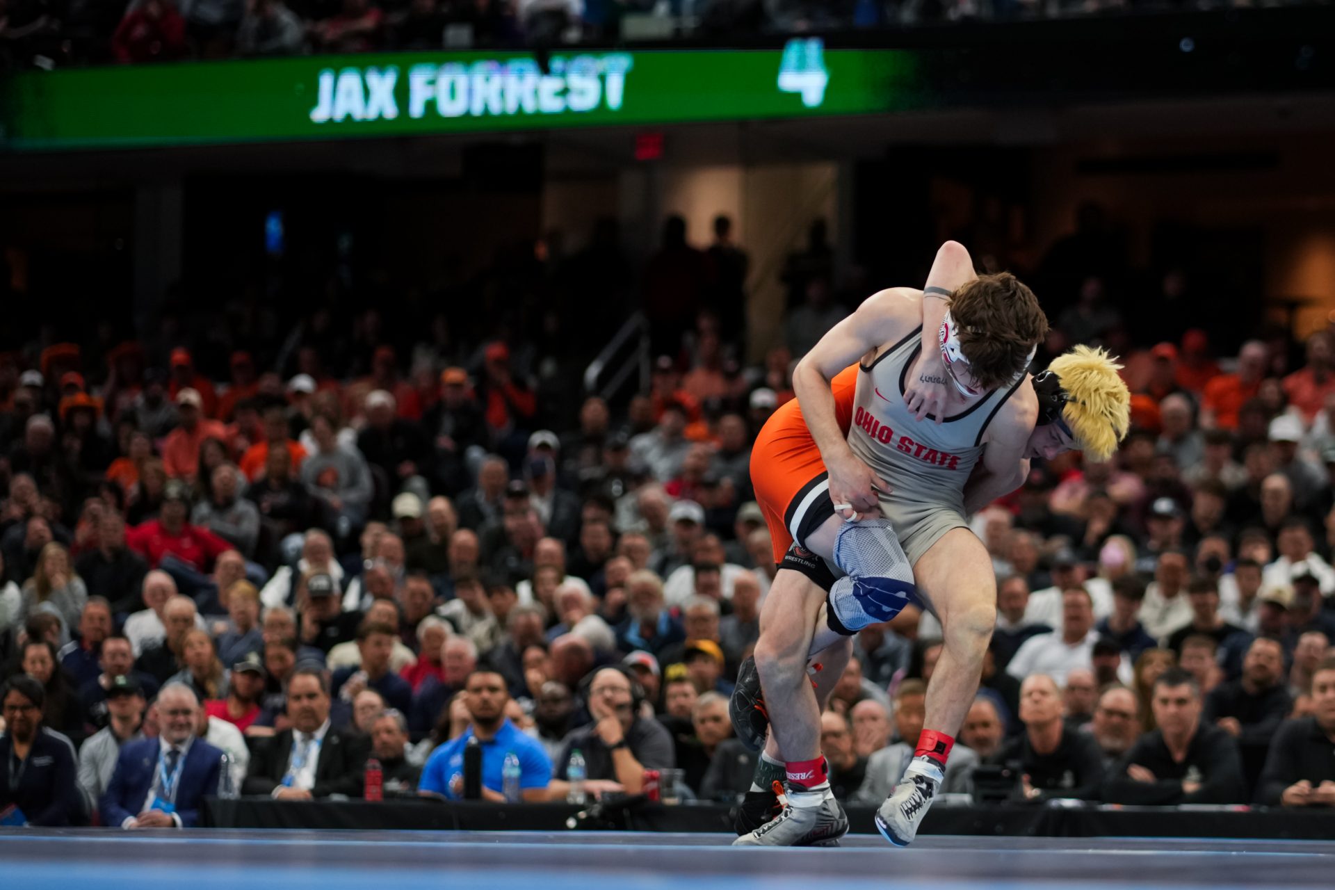 Oklahoma State Cowboys Jax Forrest competes against Ohio State Buckeyes Ben Davino during the NCAA DI Wrestling Championship at Rocket Arena.