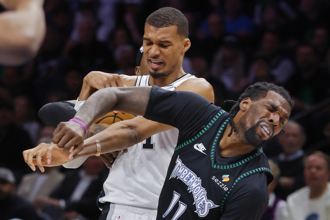 San Antonio Spurs center Victor Wembanyama (1) commits a level two flagrant foul against Minnesota Timberwolves center Naz Reid (11) in the second quarter of game four of the second round of the 2026 NBA Playoffs at Target Center. Wembanyama had to leave the game.