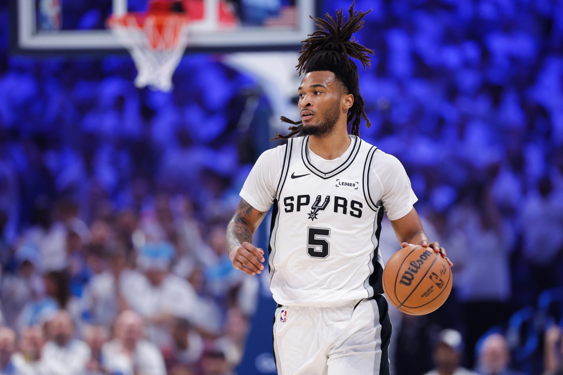 San Antonio Spurs guard Stephon Castle (5) looks to pass during the second quarter against the Oklahoma City Thunder during game two of the western conference finals for the 2026 NBA playoffs at Paycom Center - Source: Imagn Images