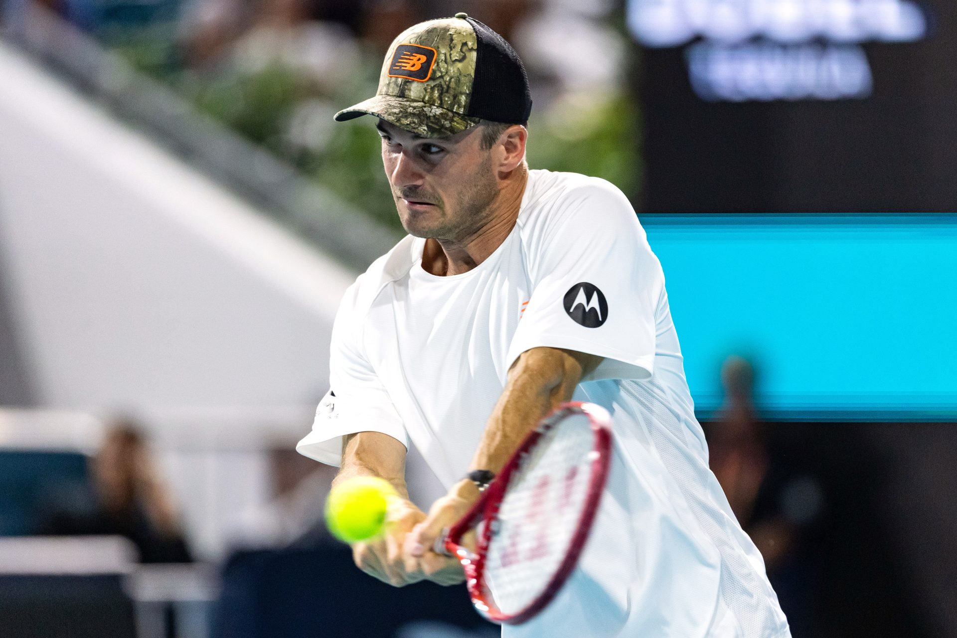 Tommy Paul of the United States hits a backhand during his match against Arthur Fils of France in the quarter finals of the men’s singles at the Miami Open at Hard Rock Stadium.