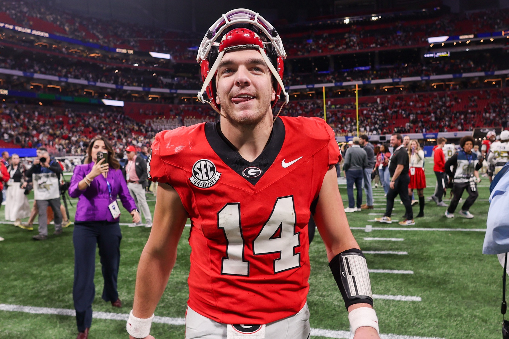 Georgia Bulldogs quarterback Gunner Stockton (14) celebrates after a victory over the Georgia Tech Yellow Jackets at Mercedes-Benz Stadium.