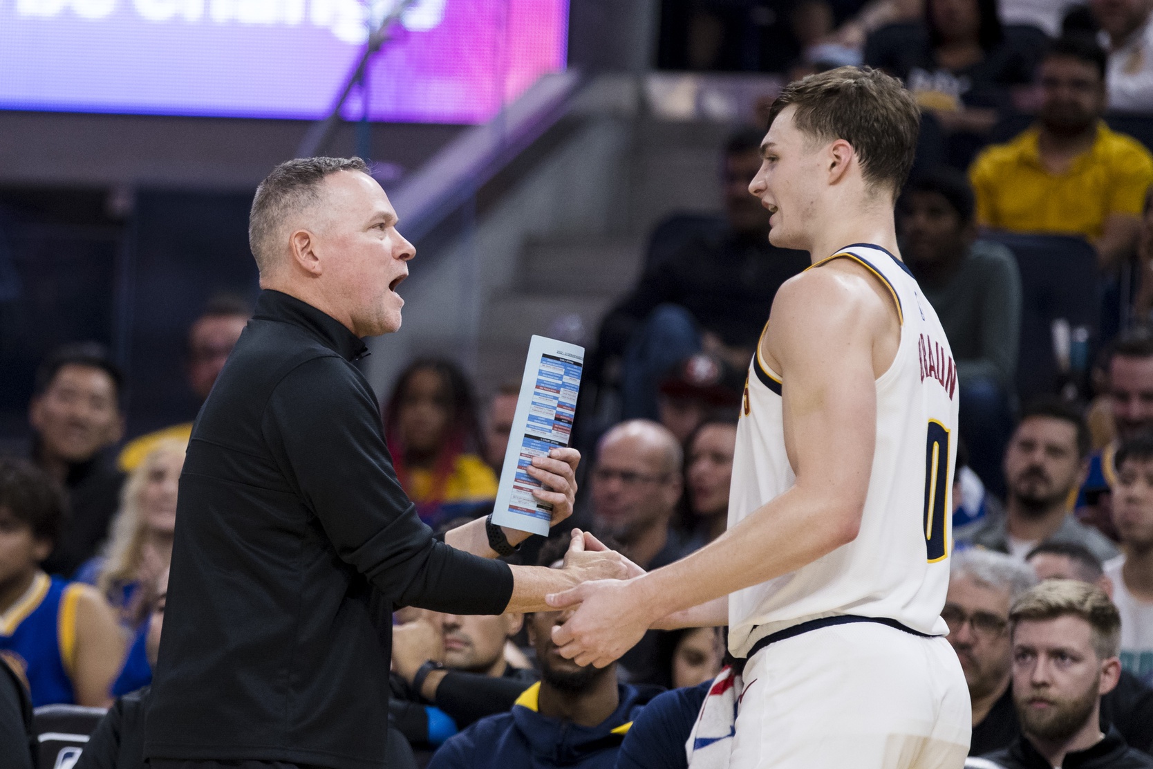 Denver Nuggets head coach Mike Malone talks to guard Christian Braun (0) during the second half of the game against the Golden State Warriors at Chase Center. Source: Imagn