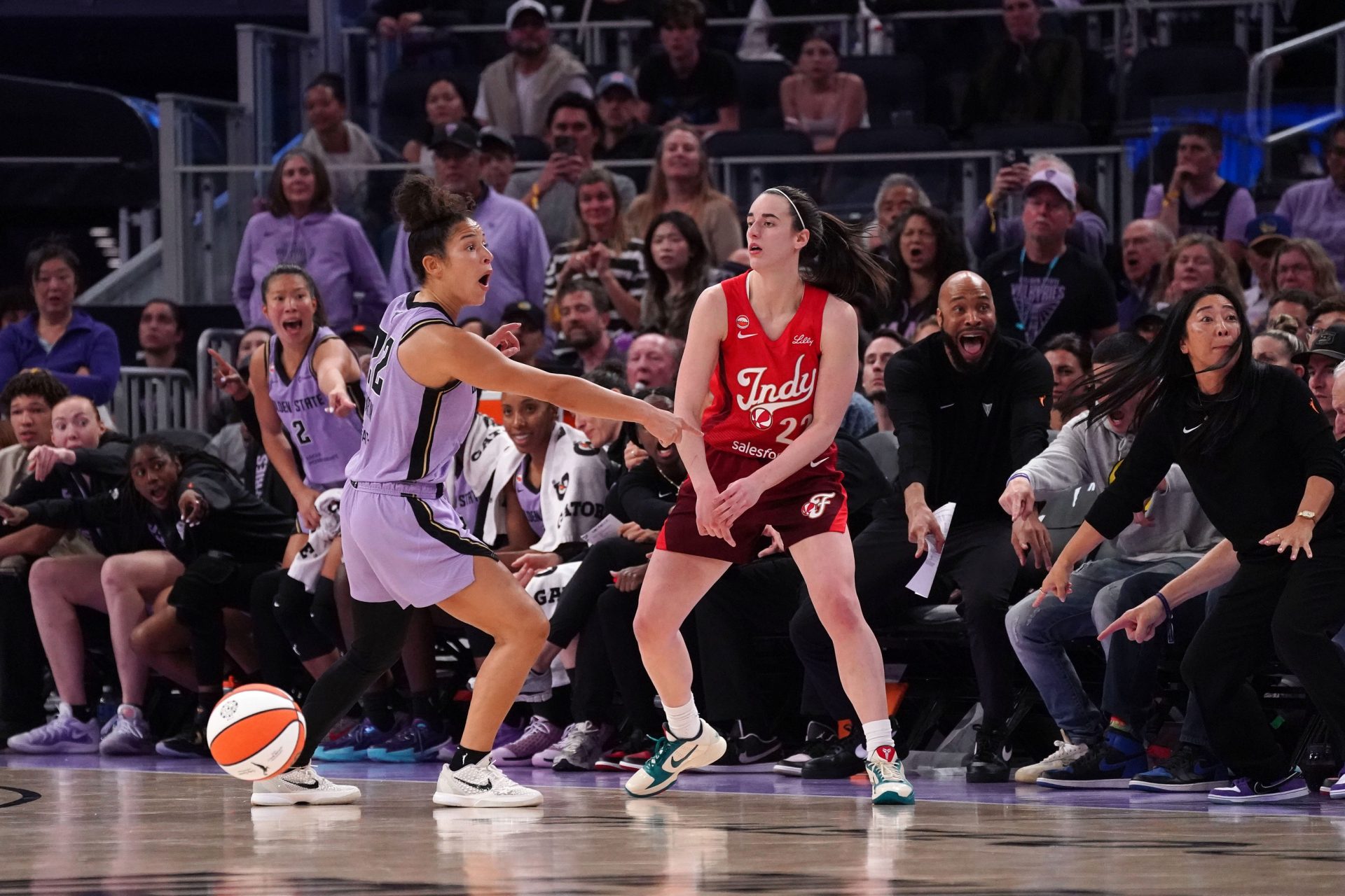 Golden State Valkyries guard Veronica Burton (22) shows that Indiana Fever guard Caitlin Clark (22) had a foot out of bounds in the final minutes of the fourth quarter at Chase Center - Source: Imagn Images