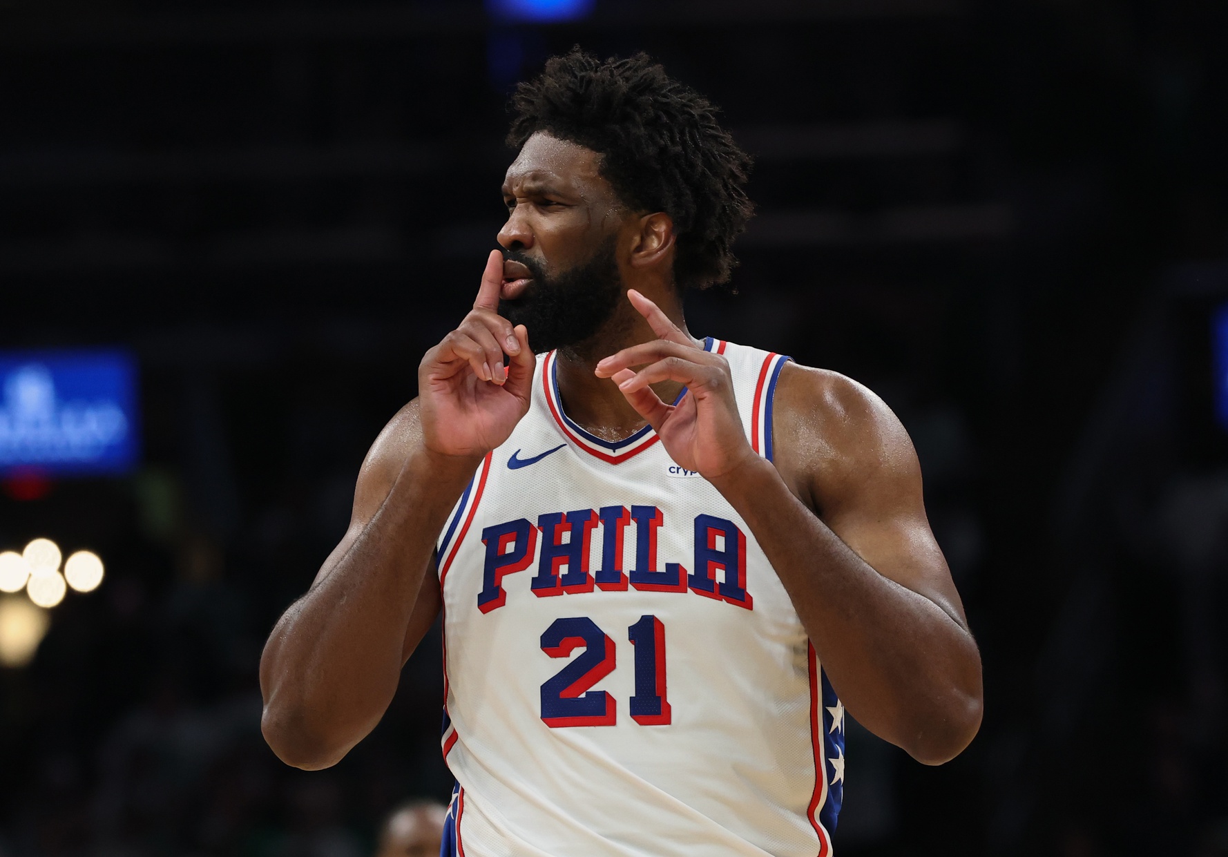 Philadelphia 76ers center Joel Embiid (21) silences the crowd after making a shot against the Boston Celtics during the second quarter of game seven of the first round of the 2026 NBA Playoffs at TD Garden.
