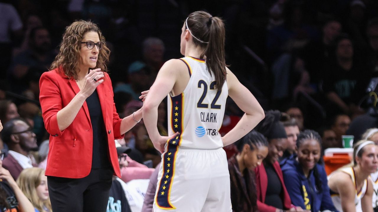 Indiana Fever head coach Stephanie White talks with guard Caitlin Clark (22) in the second quarter against the New York Liberty at Barclays Center - Source: Imagn Images