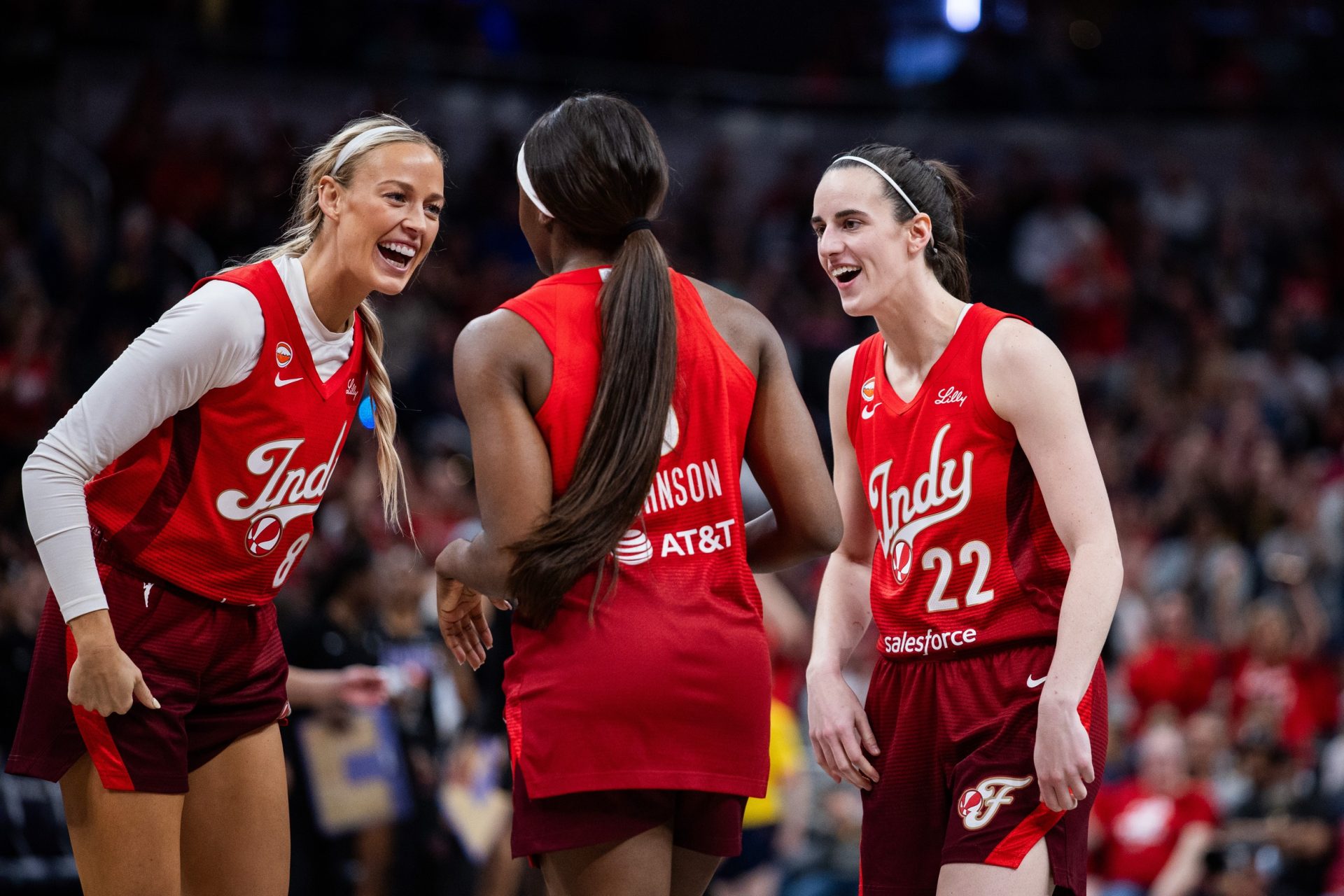 Indiana Fever guard Caitlin Clark (22) and  guard Sophie Cunningham (8) celebrate a made shot with  guard Raven Johnson (3) in the second half against the Golden State Valkyries at Gainbridge Fieldhouse - Source: Imagn Images
