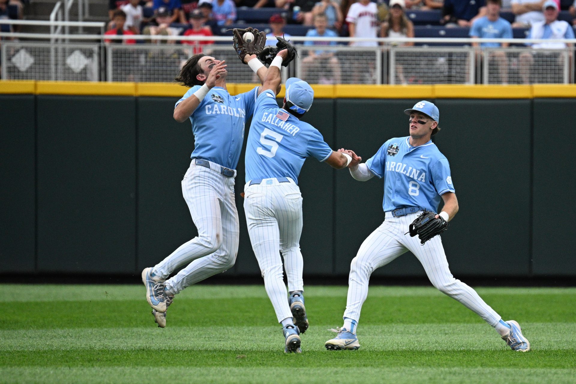 North Carolina players collide - Game 1 of CWS Finals | Source: Imagn