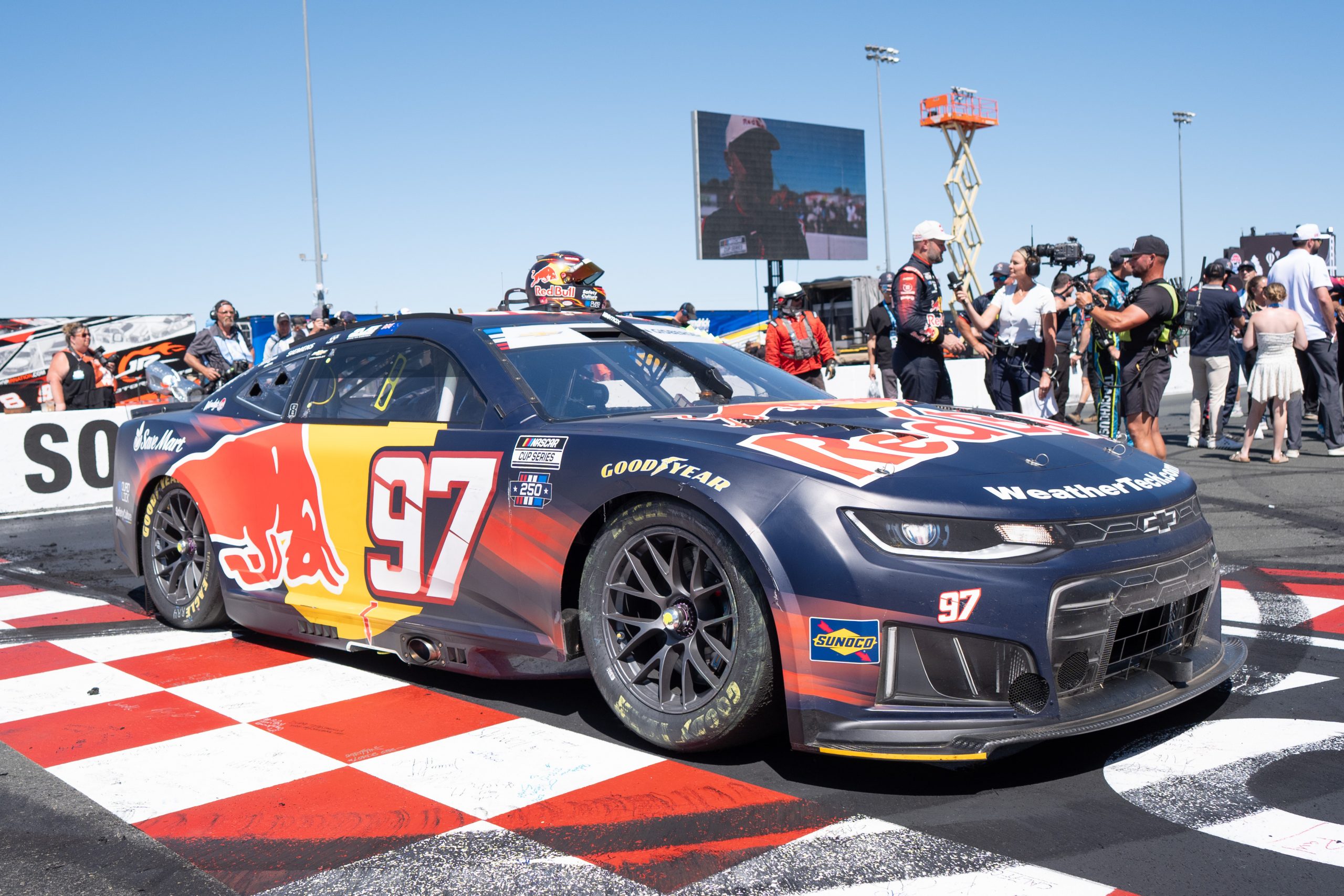 Jun 28, 2026; Sonoma, California, USA; Trackhouse Racing driver Shane Van Gisbergen (97) speaks with reporters after winning the NASCAR Toyota / Save Mart 350 series race at Sonoma Raceway. Mandatory Credit: Stan Szeto-Imagn Images