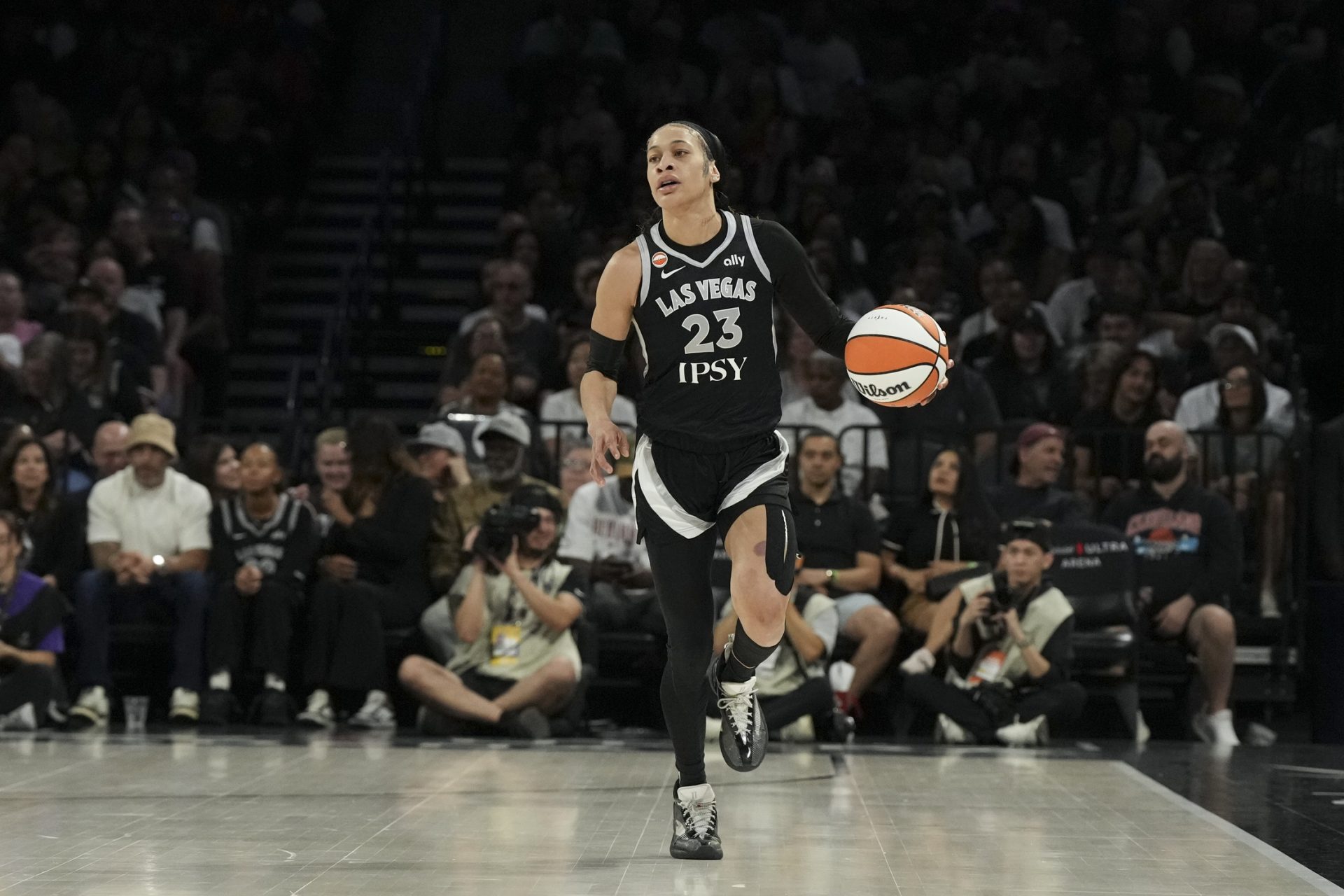 Las Vegas Aces guard Chennedy Carter (23) dribbles against the Los Angeles Sparks in the first quarter of their game at Michelob Ultra Arena - Source: Imagn Images