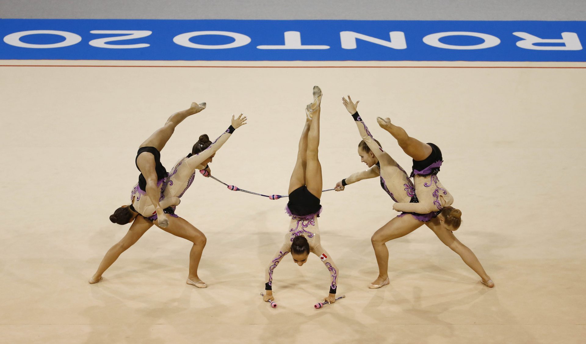 Canada competes in the rhythmic gymnastics group clubs/hoops final during the 2015 Pan Am Games at Toronto Coliseum.