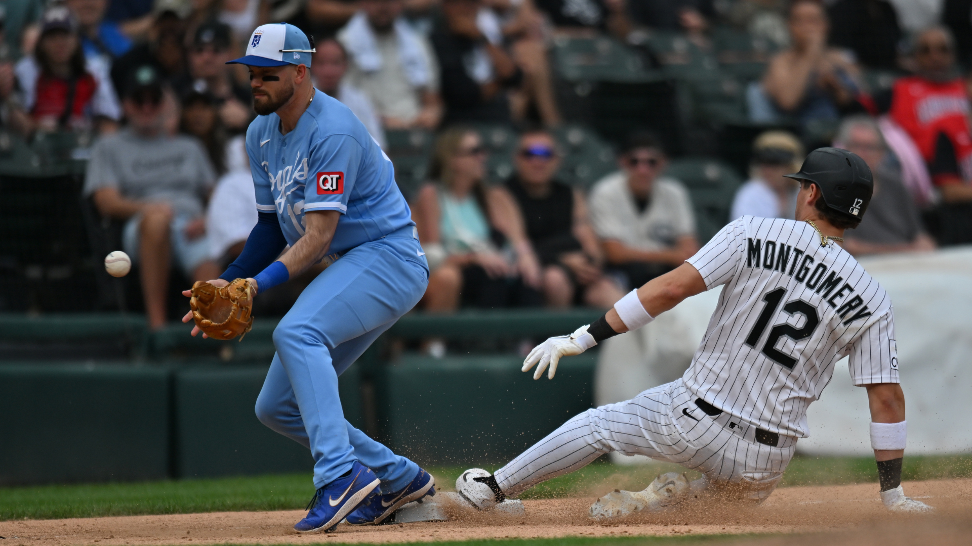 Chicago White Sox shortstop Colson Montgomery (12) slides into third base against Kansas City Royals third baseman Nick Loftin. Source: IMAGN