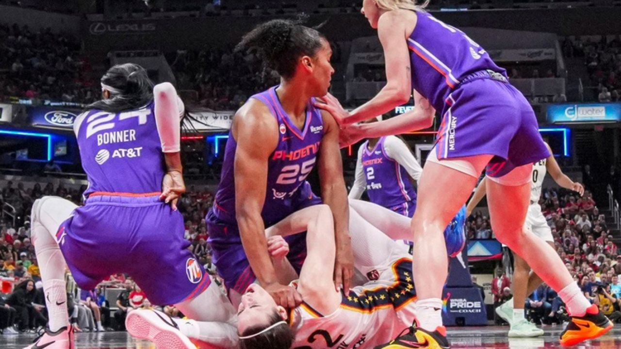 Phoenix Mercury forward Alyssa Thomas (25) scrambles to get up over Indiana Fever guard Caitlin Clark (22) on Wednesday, June 24, 2026, during a game at Gainbridge Fieldhouse - Source: Imagn Images