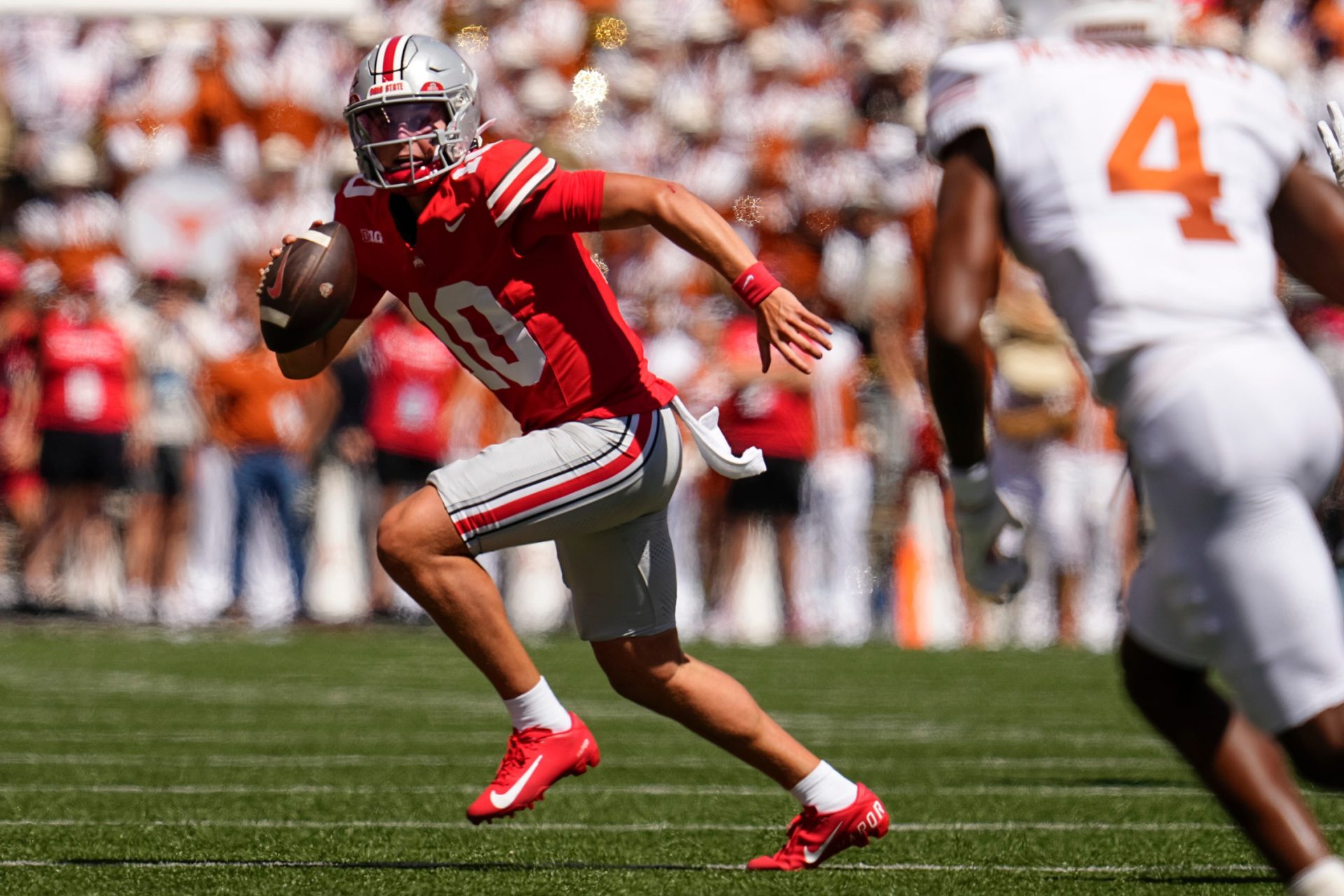 Ohio State Buckeyes quarterback Julian Sayin (10) runs during the first half of the NCAA football game against the Texas Longhorns at Ohio Stadium on Aug. 30, 2025. Credit: Imagn