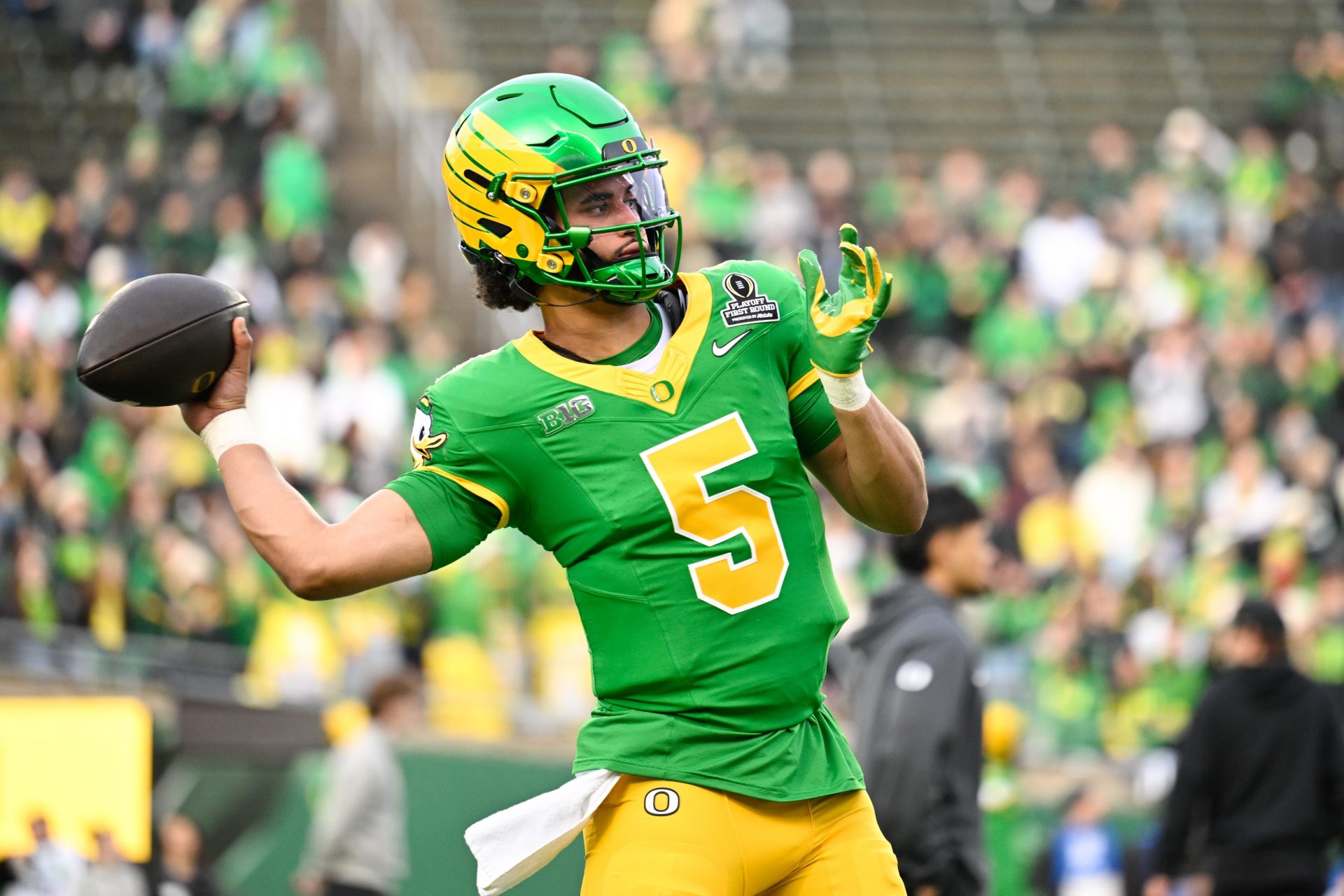 Oregon Ducks quarterback Dante Moore (5) warms up before the game against the James Madison Dukes at Autzen Stadium.