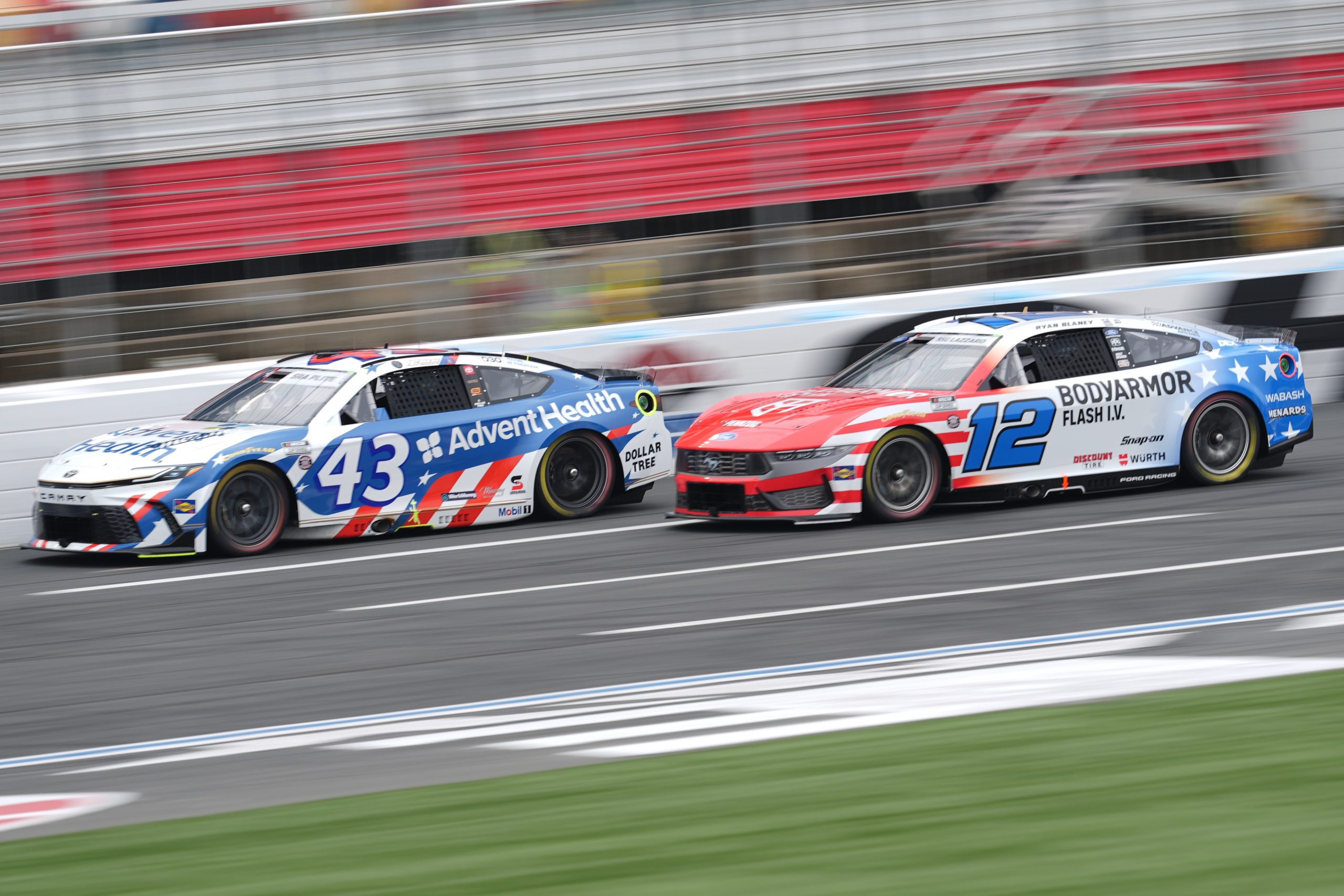 Legacy Motor Club driver Erik Jones (43) and Team Penske Ford driver Ryan Blaney (12) during qualifying at Charlotte Motor Speedway. 
