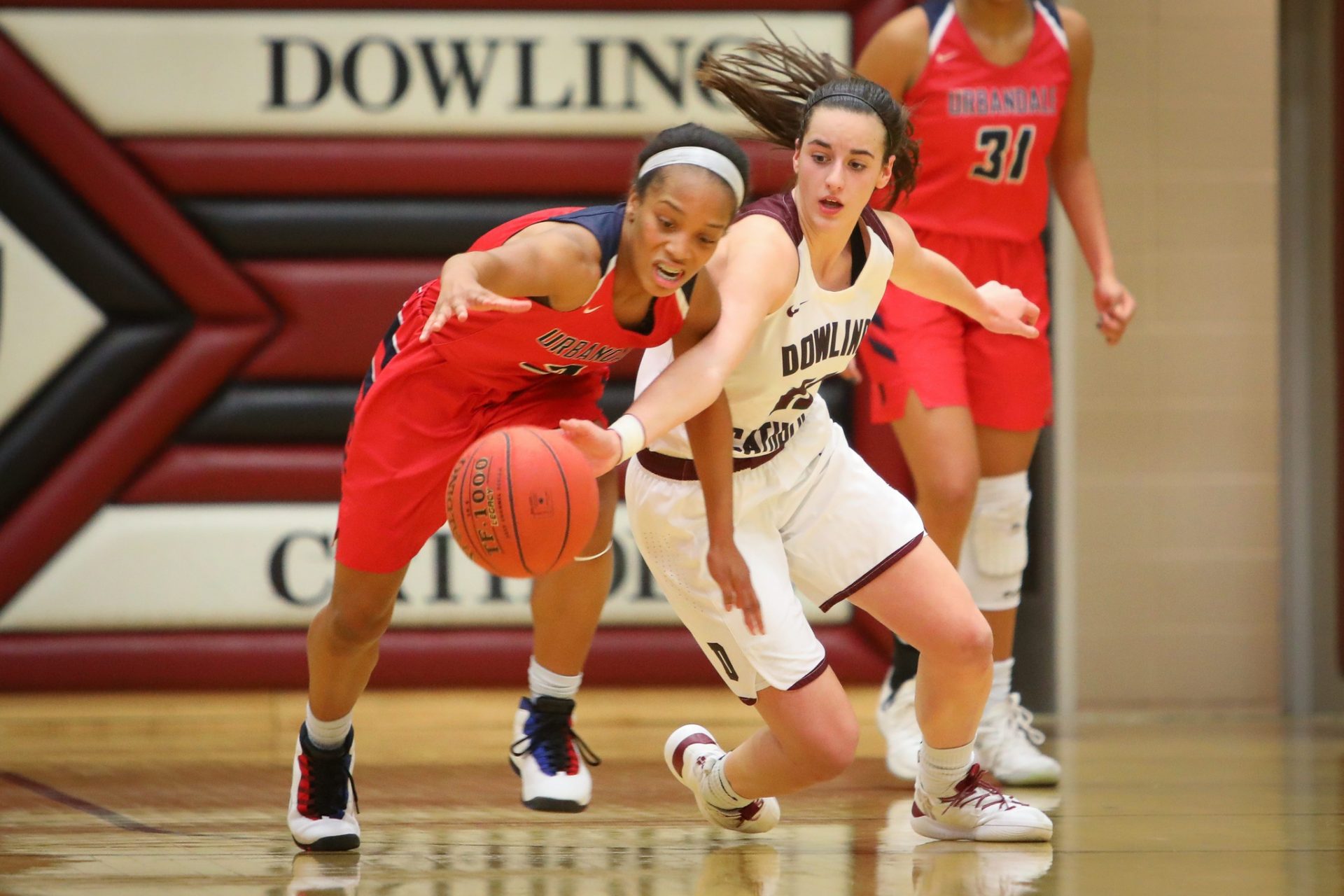 Urbandale senior Dee Dee Pryor and Dowling junior Caitlin Clark fight for the ball during a girlsÕ high school basketball game between the Urbandale J-Hawks and the Dowling Catholic Maroons at Dowling Catholic High School on Jan. 11, 2019 in West Des Moines, Iowa. Credit: Imagn