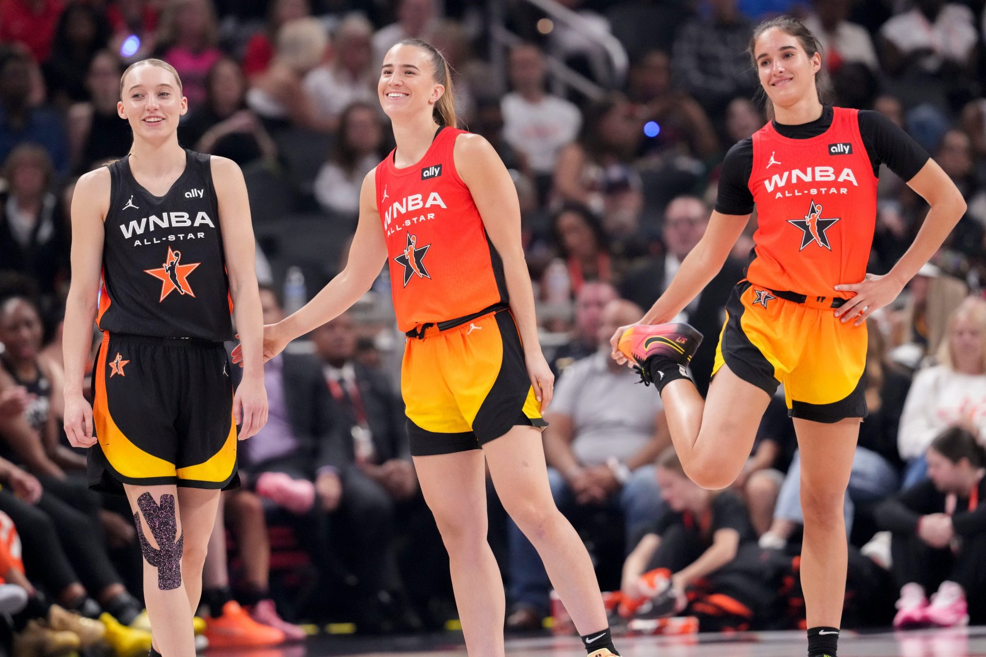 Dallas Wings' Paige Bueckers (5), New York Liberty's Sabrina Ionescu (20) and Washington Mystics' Sonia Citron (22) stand on the court Saturday, July 19, 2025, during the WNBA All-Star Game at Gainbridge Fieldhouse in Indianapolis - Source: Imagn Images