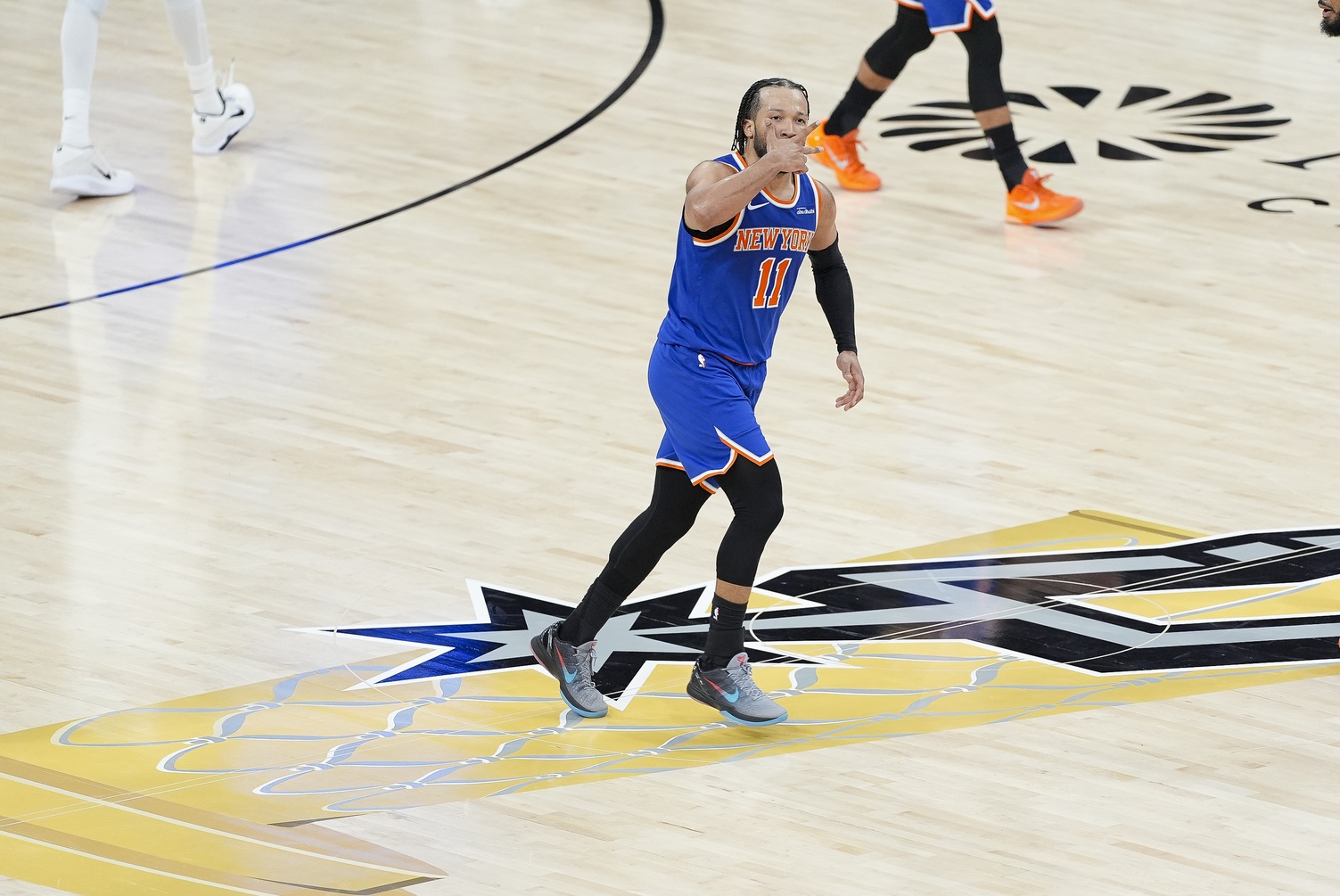 New York Knicks guard Jalen Brunson (11) celebrates after he makes a three point shot against the San Antonio Spurs during the second half during game two of the 2026 NBA Finals at Frost Bank Center - Source: Imagn Images