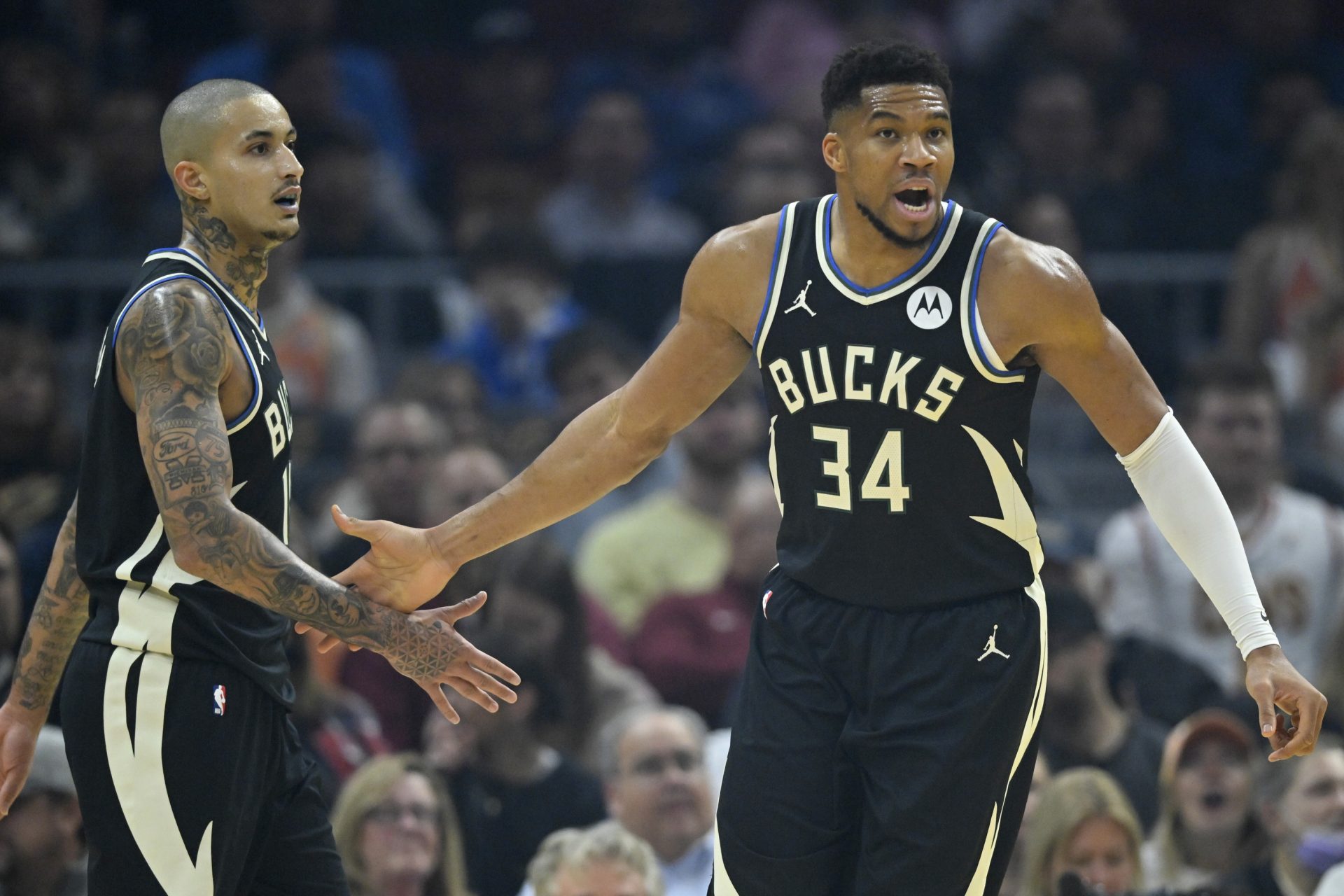 Milwaukee Bucks forward Kyle Kuzma (18) and forward Giannis Antetokounmpo (34) celebrate in the first quarter against the Cleveland Cavaliers at Rocket Arena - Source: Imagn Images