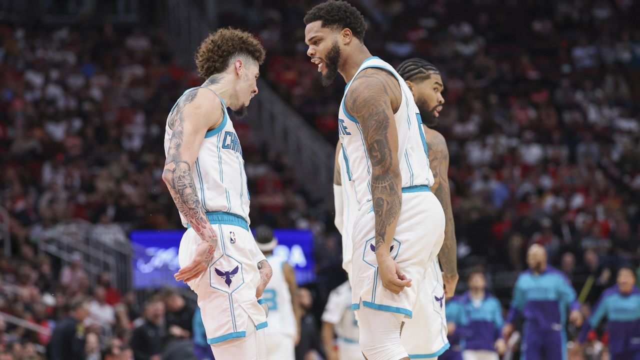 Charlotte Hornets forward Miles Bridges (0) celebrates with guard LaMelo Ball (1) after scoring a basket during the fourth quarter against the Houston Rockets at Toyota Center - Source: Imagn Images